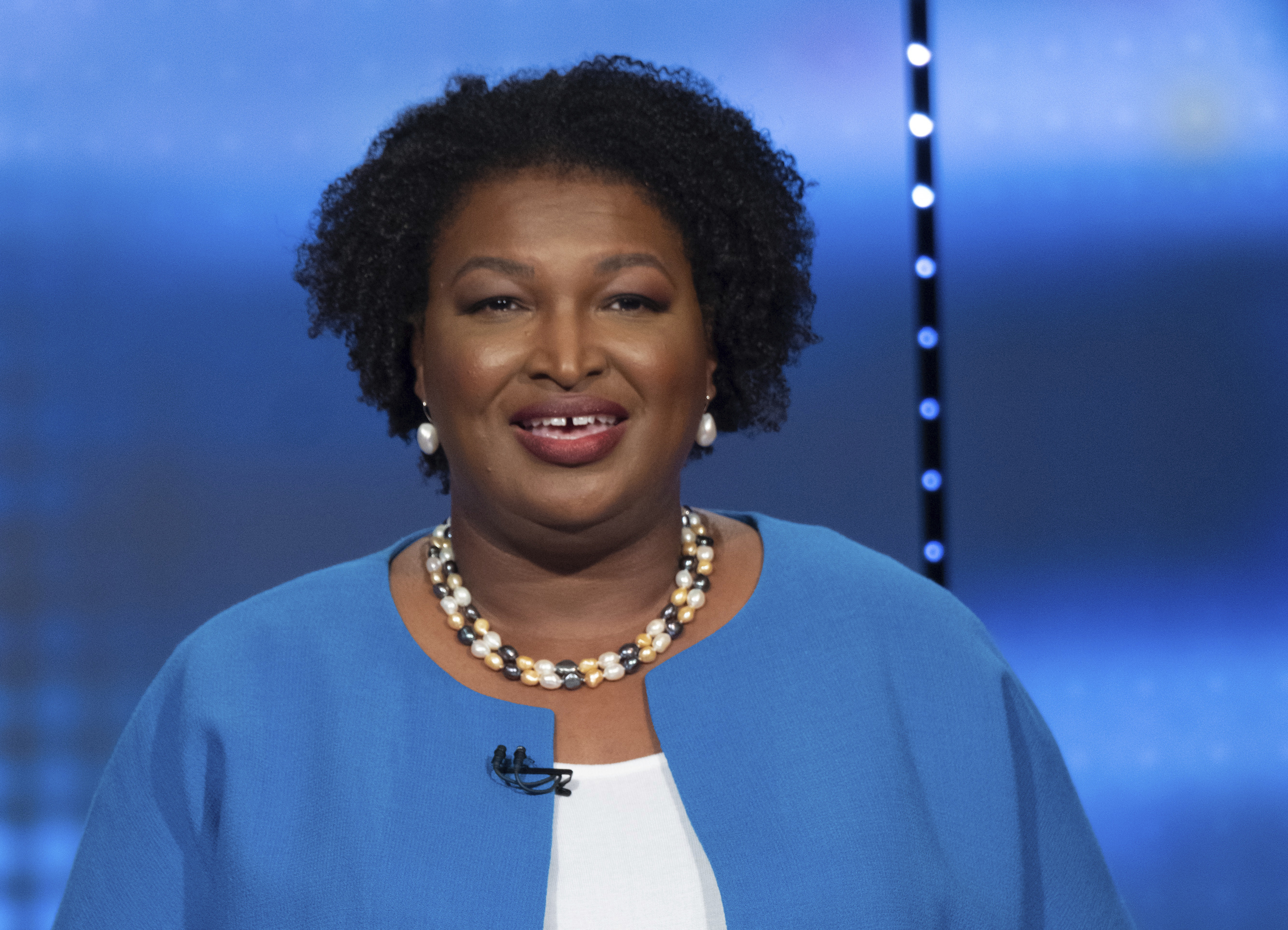 Abrams speaks at the debate Sunday.