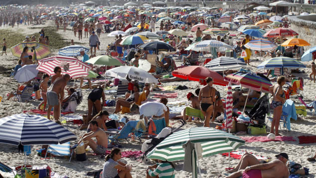 In the region of Galicia, on the Atlantic Ocean, Sanxenxo will only allow sunbathers entry on a "first come, first served" basis.