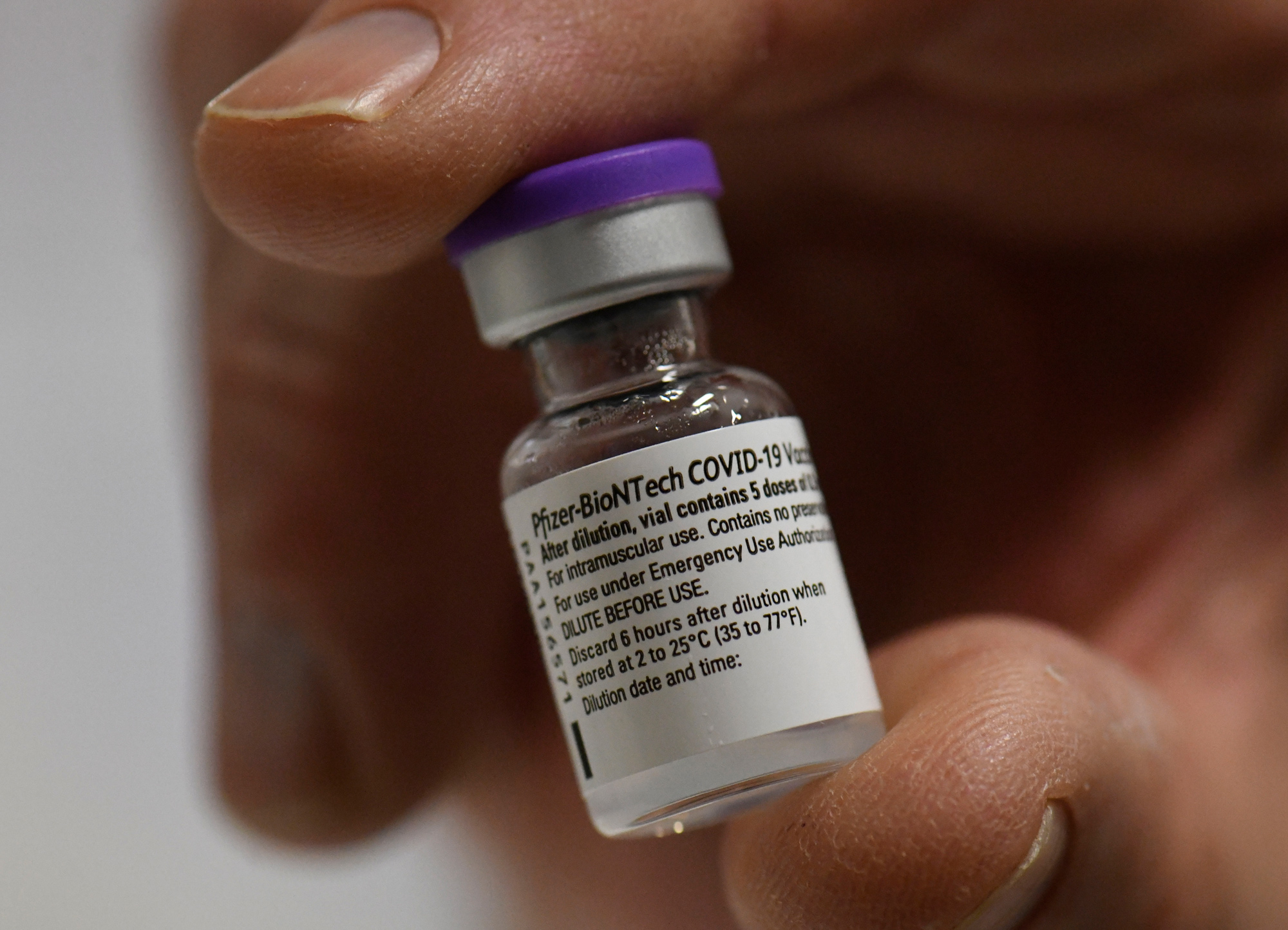 A vial with the Pfizer-BioNTech Covid-19 vaccine is seen at the Robert Bosch hospital in Stuttgart, Germany, on December 27.