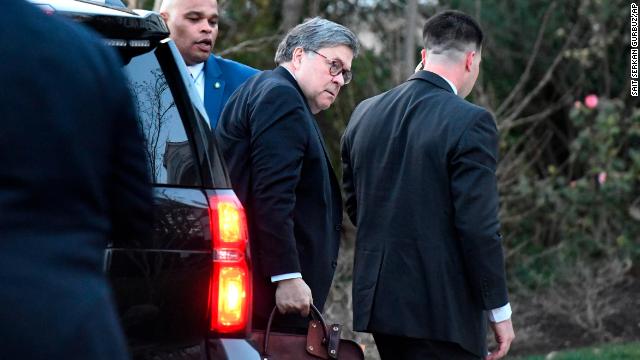 Attorney General William Barr arrives at home on Friday evening.