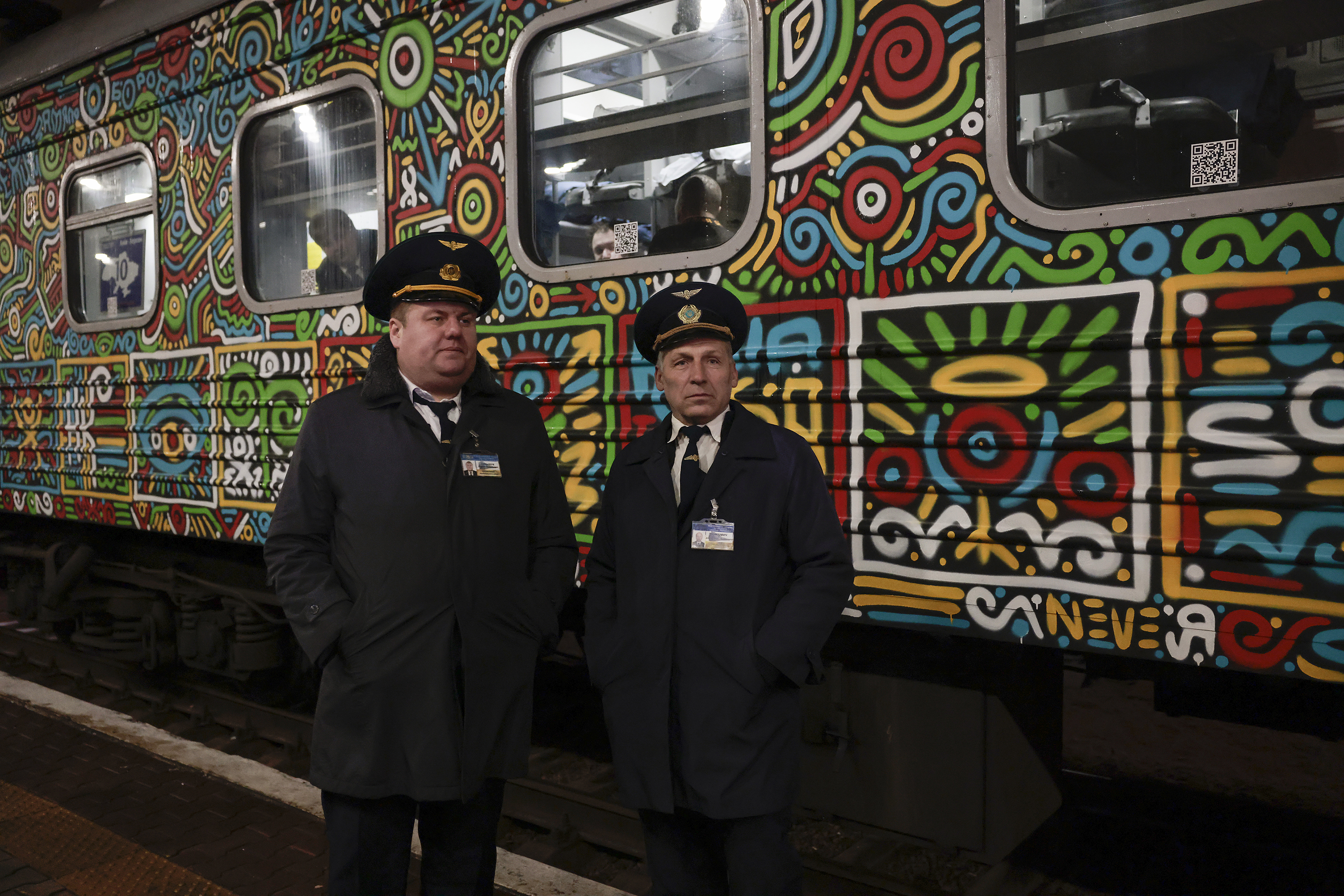 Passengers and staff go aboard the first train departing Kyiv railway station after Ukrainian forces reclaimed the occupied city on November 18, in Kyiv, Ukraine.
