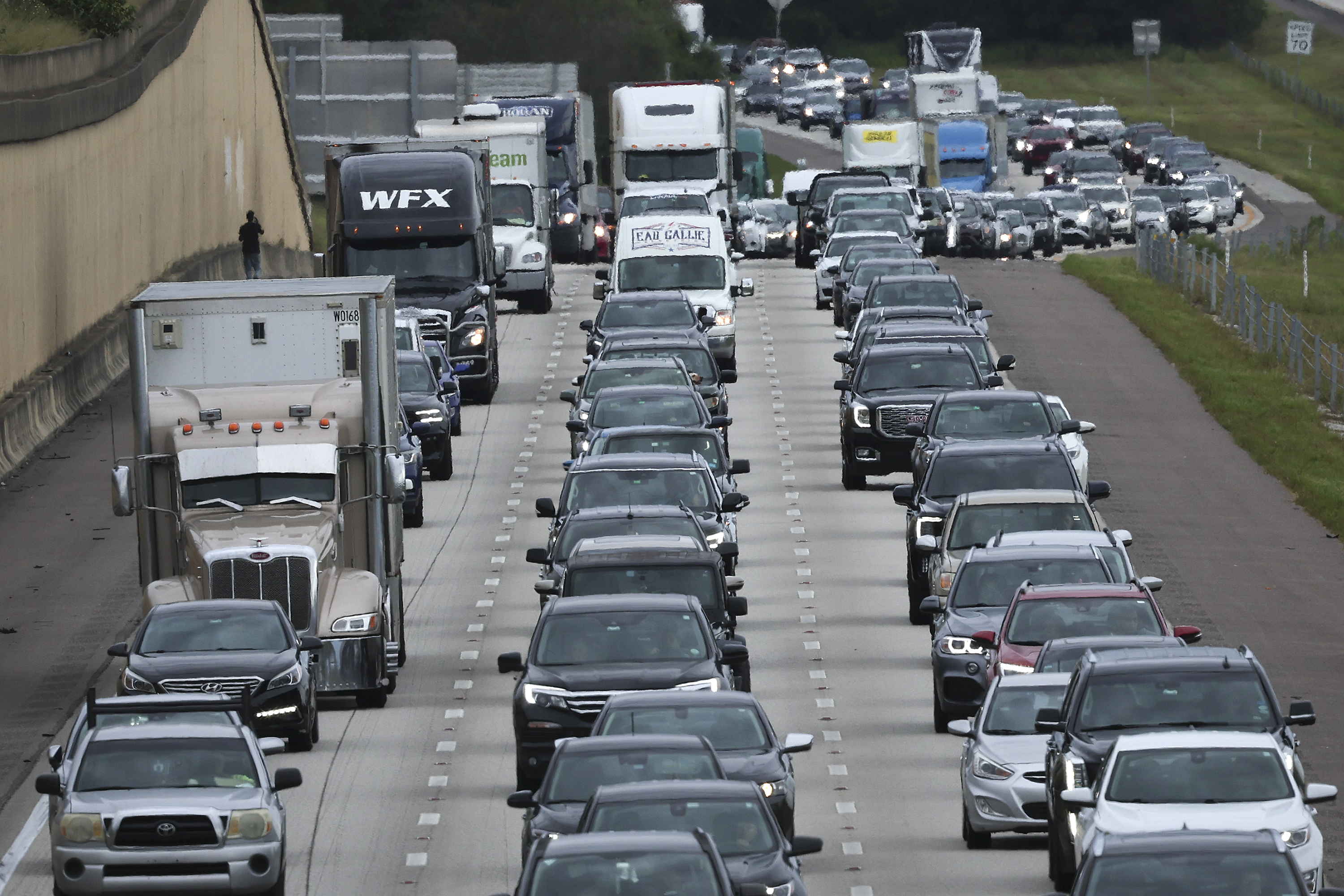 Traffic moves slowly on I-4 East as residents evacuate the Gulf Coast of Florida in advance of the arrival of Hurricane Ian on Tuesday, in Four Corners, Florida.