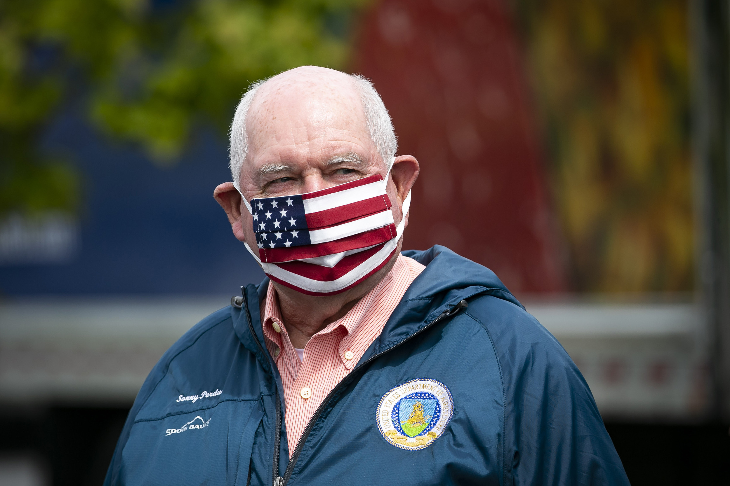 Sonny Perdue, the U.S. Secretary of Agriculture, wears a protective mask during a tour of the distribution center of Coastal Sunbelt Produce in Laurel, Maryland, on Friday, May 15. 