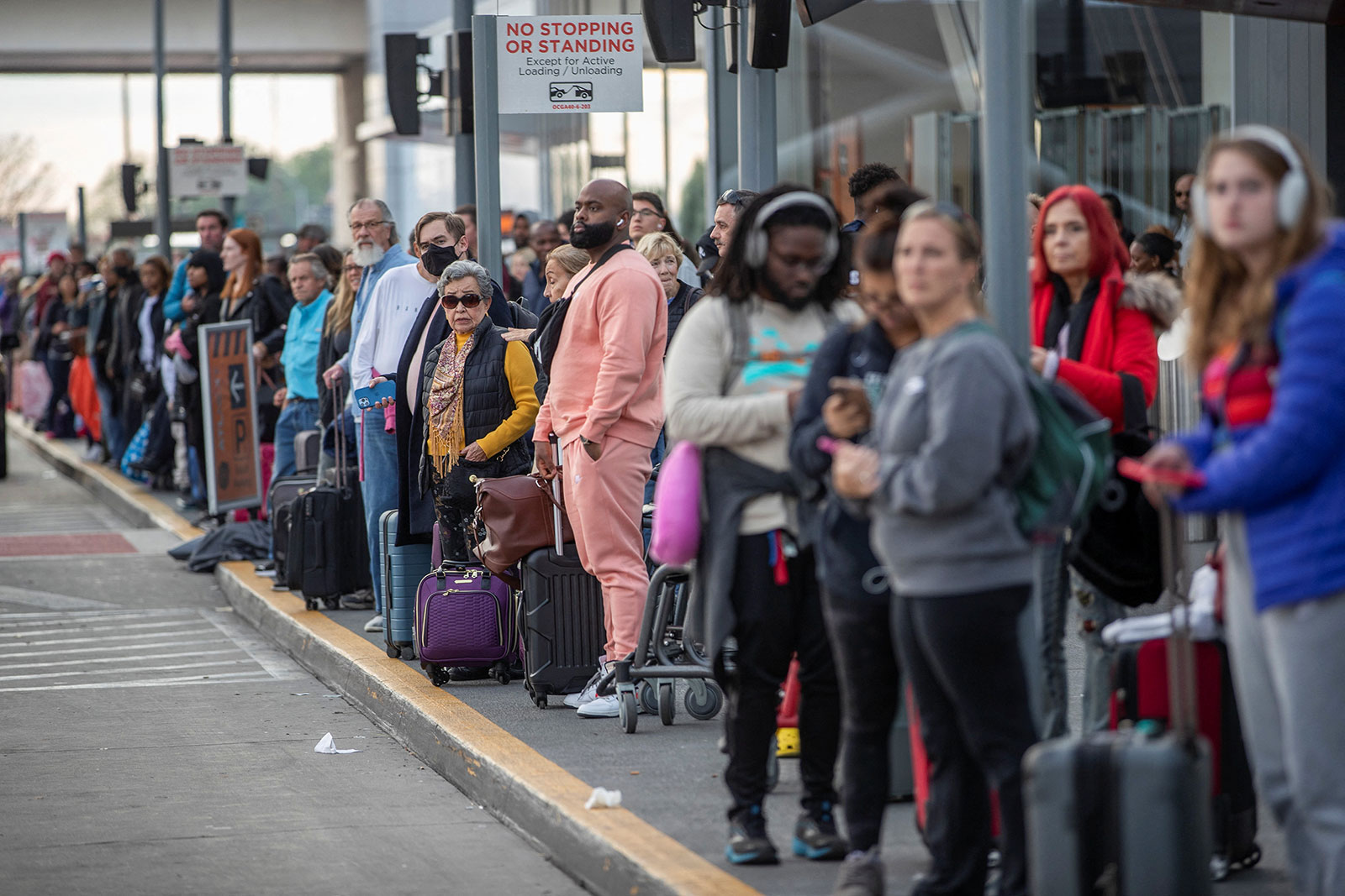 People wait to be picked up at Hartsfield-Jackson Atlanta International Airport on November 22.