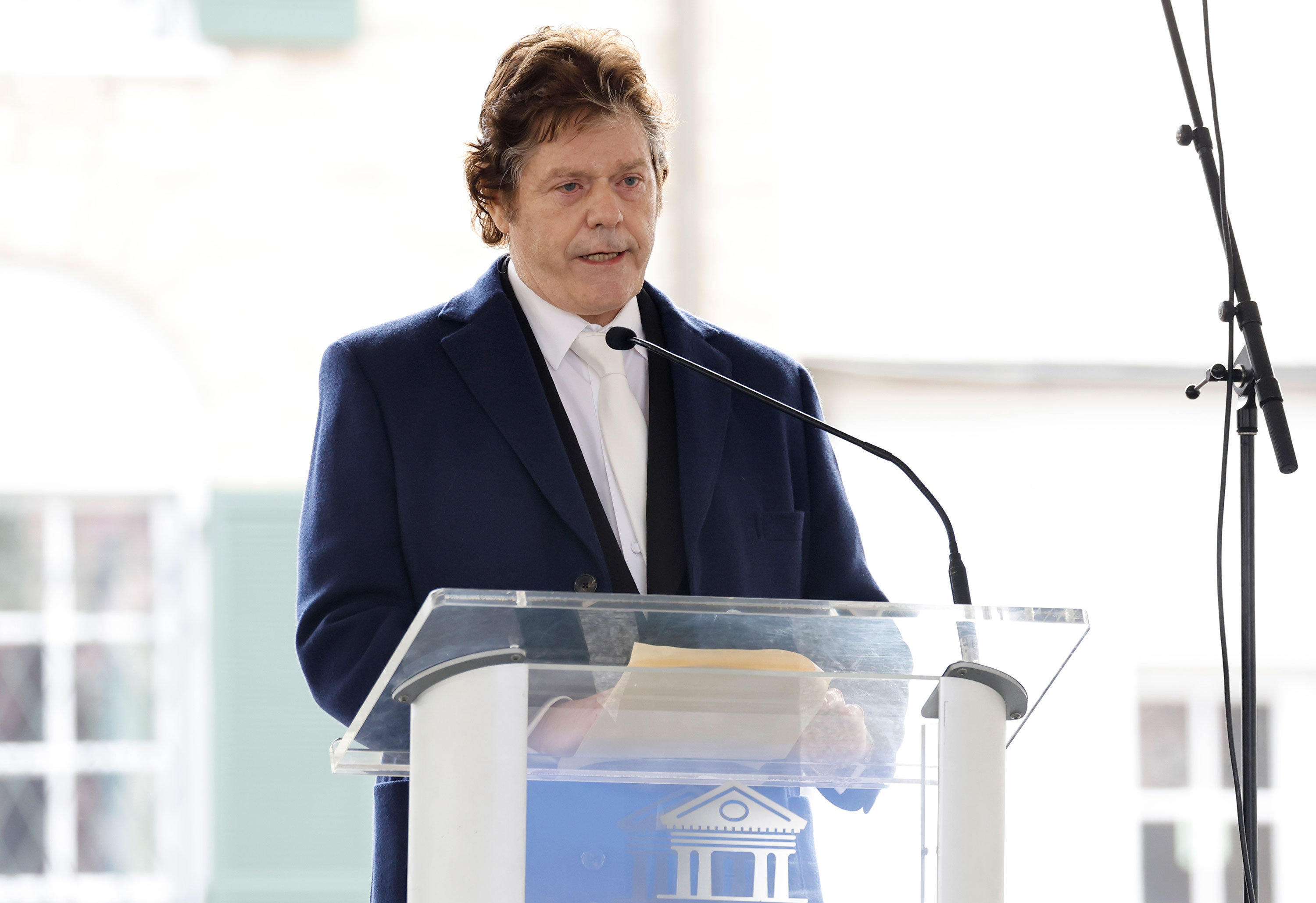 Jerry Schilling speaks at the public memorial for Lisa Marie Presley on Sunday in Memphis. 