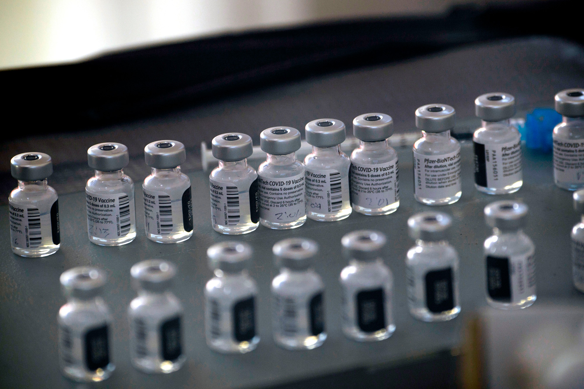 Vials of the Pfizer-BioNTech Covid-19 vaccine are prepared to be administered in Reno, Nevada, on December 17, 2020. 