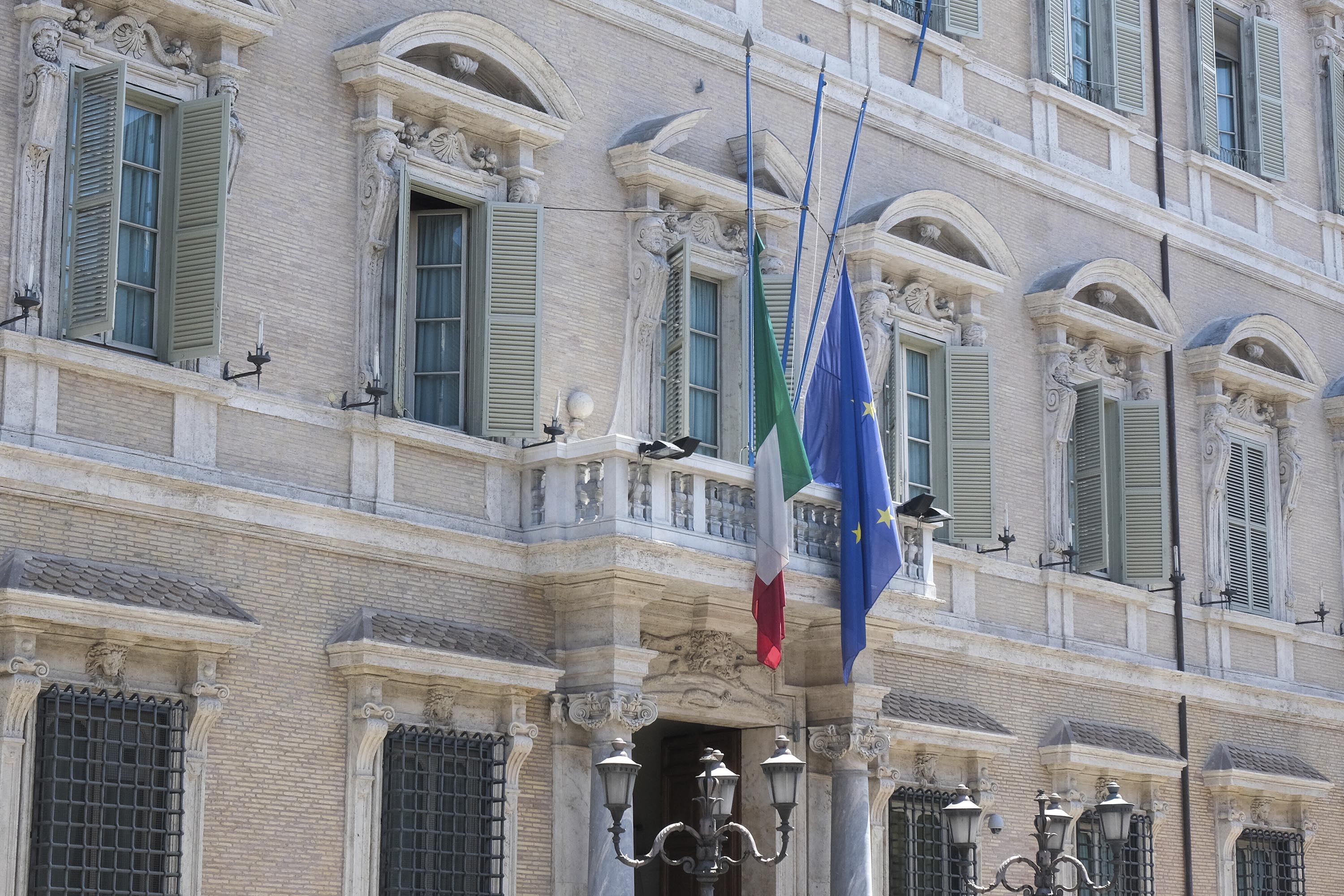 The flags of Italy and the European Union are lowered to half-staff at the Senate in Rome, following Berlusconi's death on Monday, June 12. 