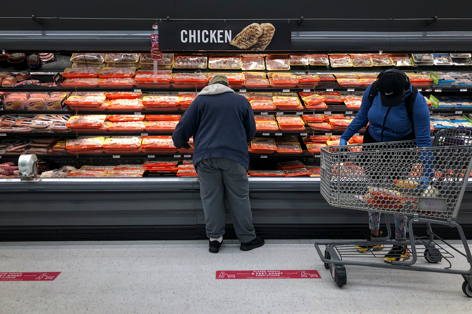 Shoppers browse in the meat section at a grocery store on April 28, in Washington, DC. 