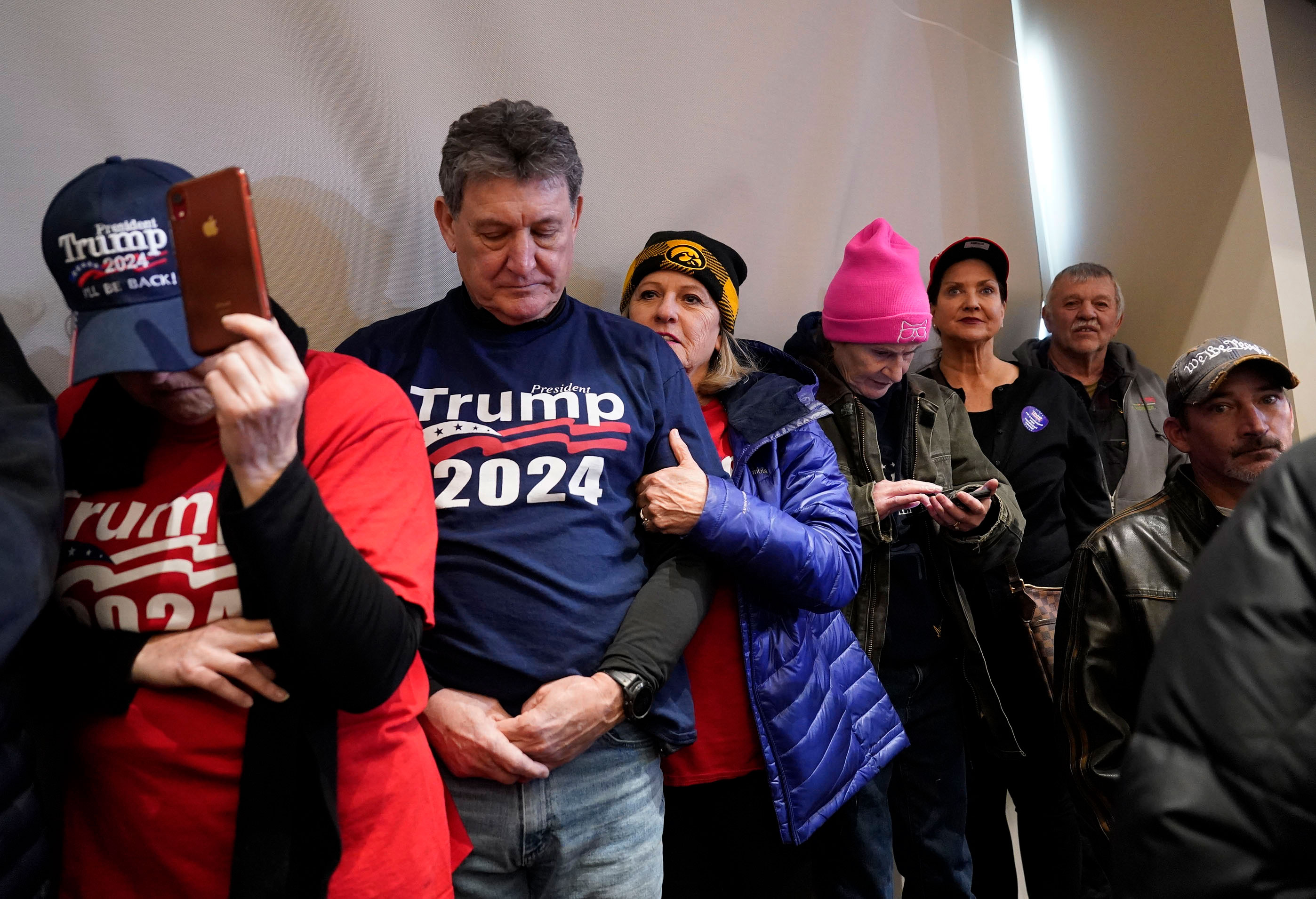 Supporters wait for former president Trump to arrive at a campaign event in Indianola, Iowa, on Sunday.