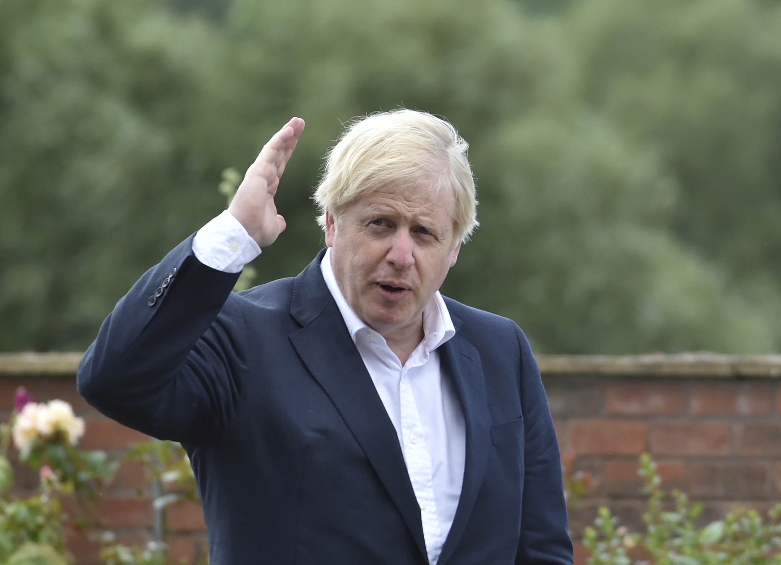 British Prime Minister Boris Johnson speaks during a visit to the Canal Side Heritage Centre in Beeston, England, on July 28.