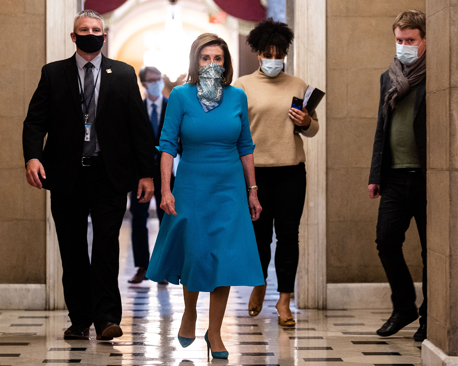 House Speaker Nancy Pelosi walks to her office following her weekly press briefing on May 7.