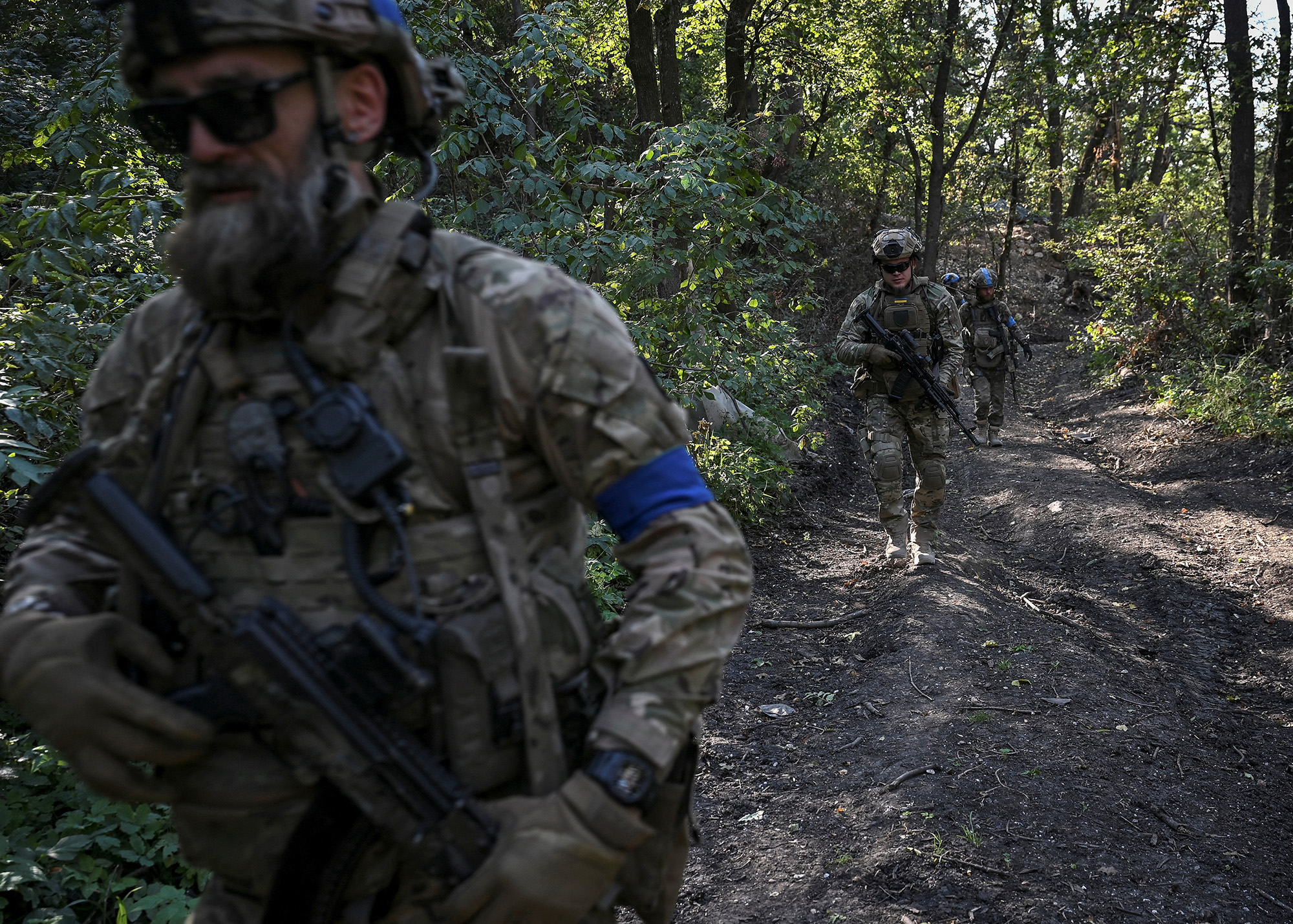 Servicemen of Ukraine's 3rd Separate Assault Brigade conduct a reconnaissance mission near Bakhmut, Ukraine, on September 7.
