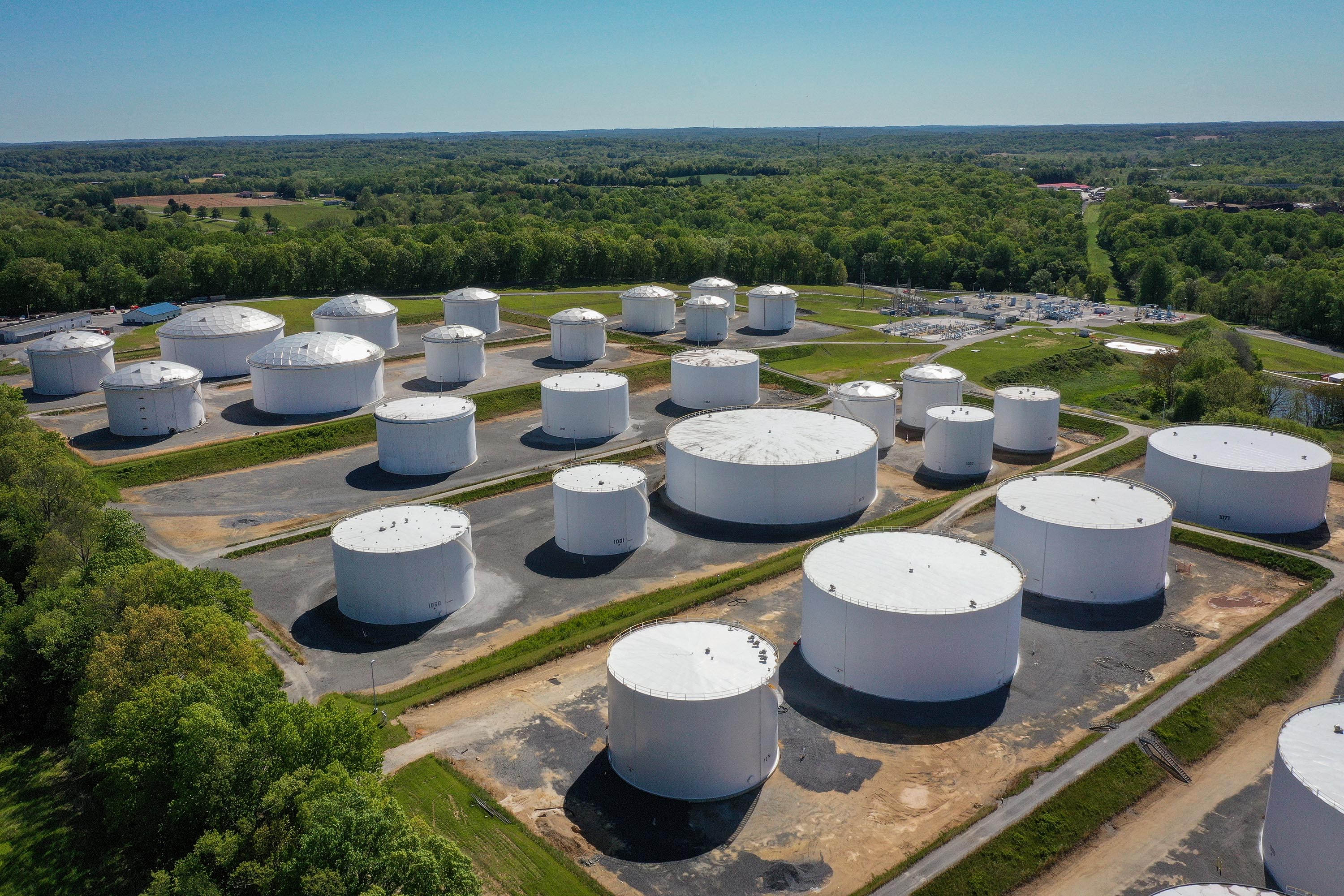  In an aerial view, fuel holding tanks are seen at Colonial Pipeline's Dorsey Junction Station on May 13, 2021 in Woodbine, Maryland. The Colonial Pipeline has returned to operations following a cyberattack.