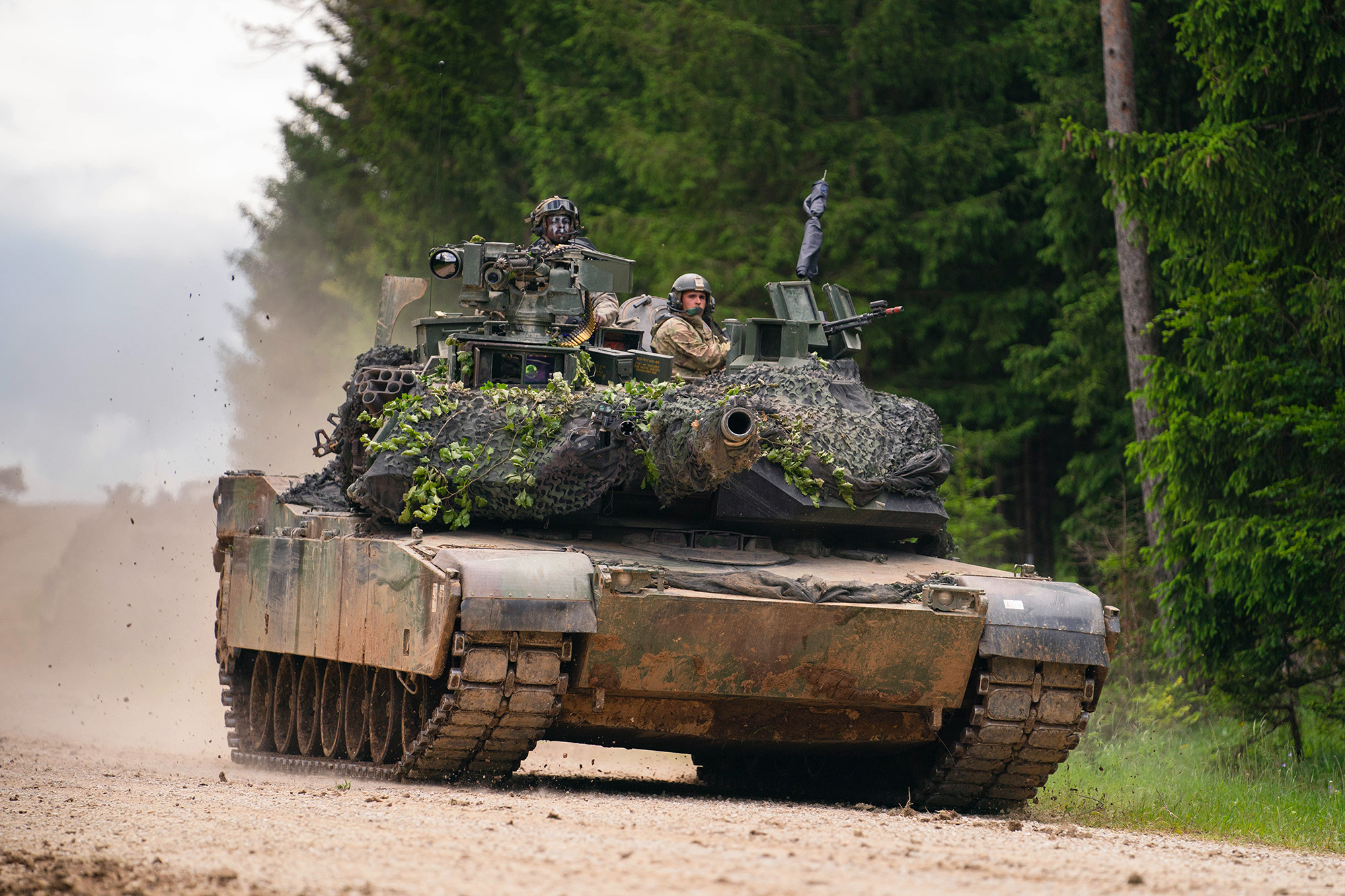 A US Army M1 Abrams tank drives across a road during a multinational exercise at the Hohenfels training area in Bavaria, Germany, on June 8.