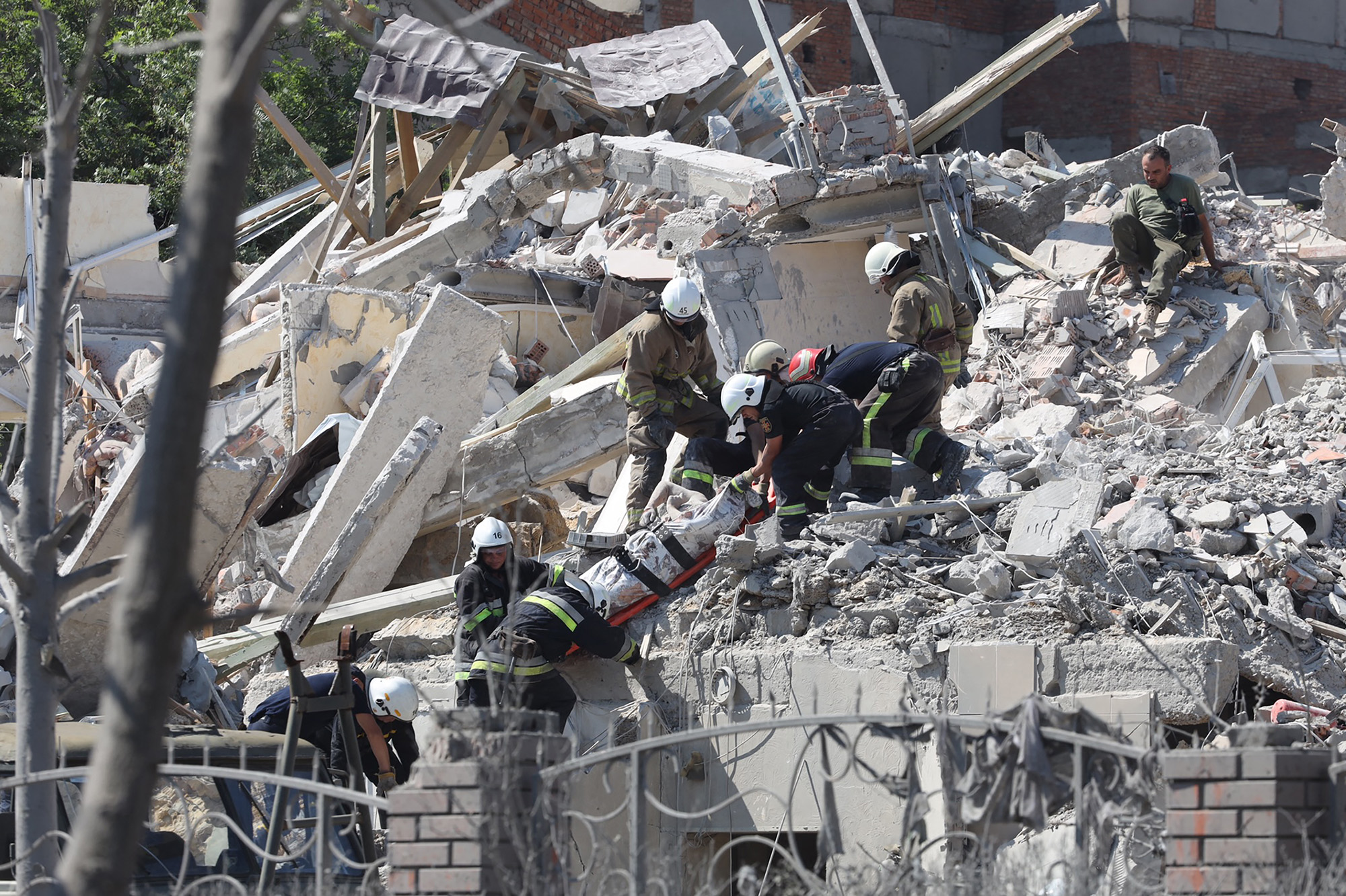Rescuers evacuate the body of a person from a destroyed building in the Ukrainian town of Sergiivka in the Odesa region on July 1.