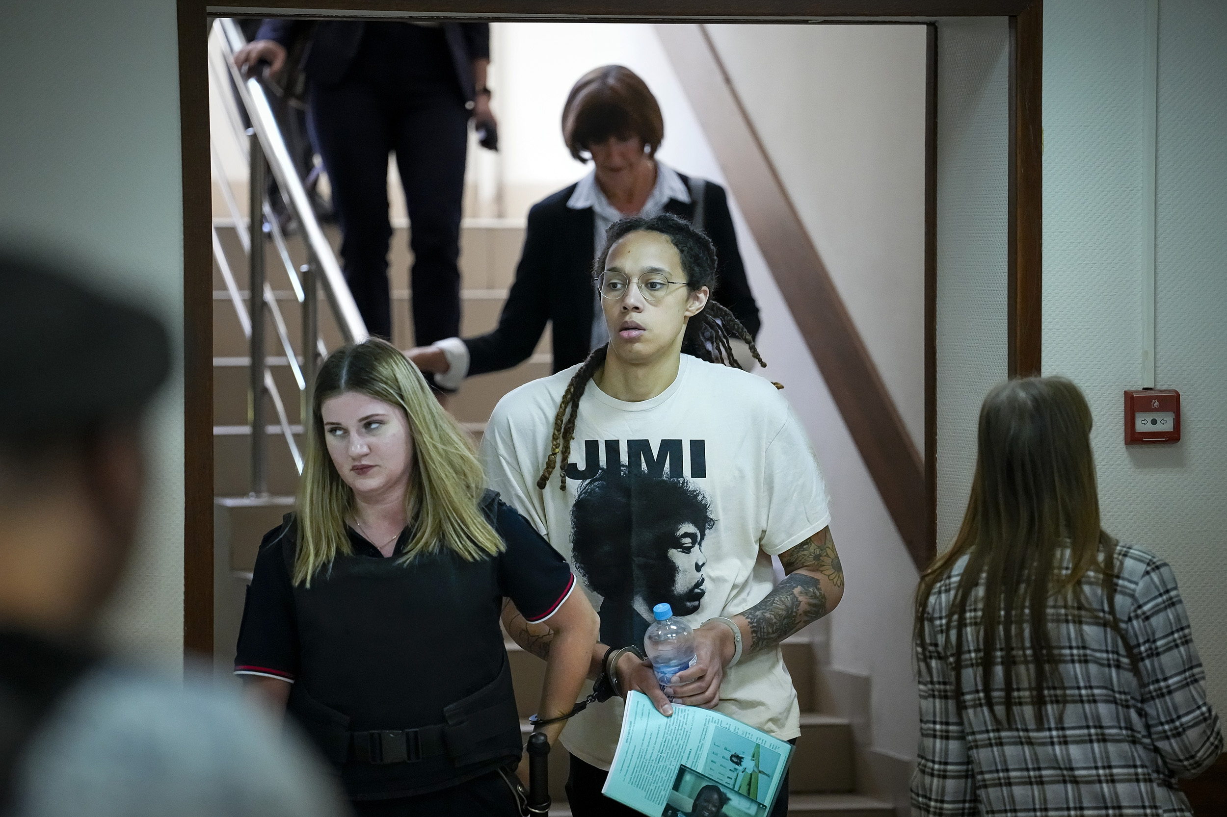 WNBA star and two-time Olympic gold medalist Brittney Griner, center, is escorted to a courtroom for a hearing, in Khimki just outside Moscow, Russia, on July 1.