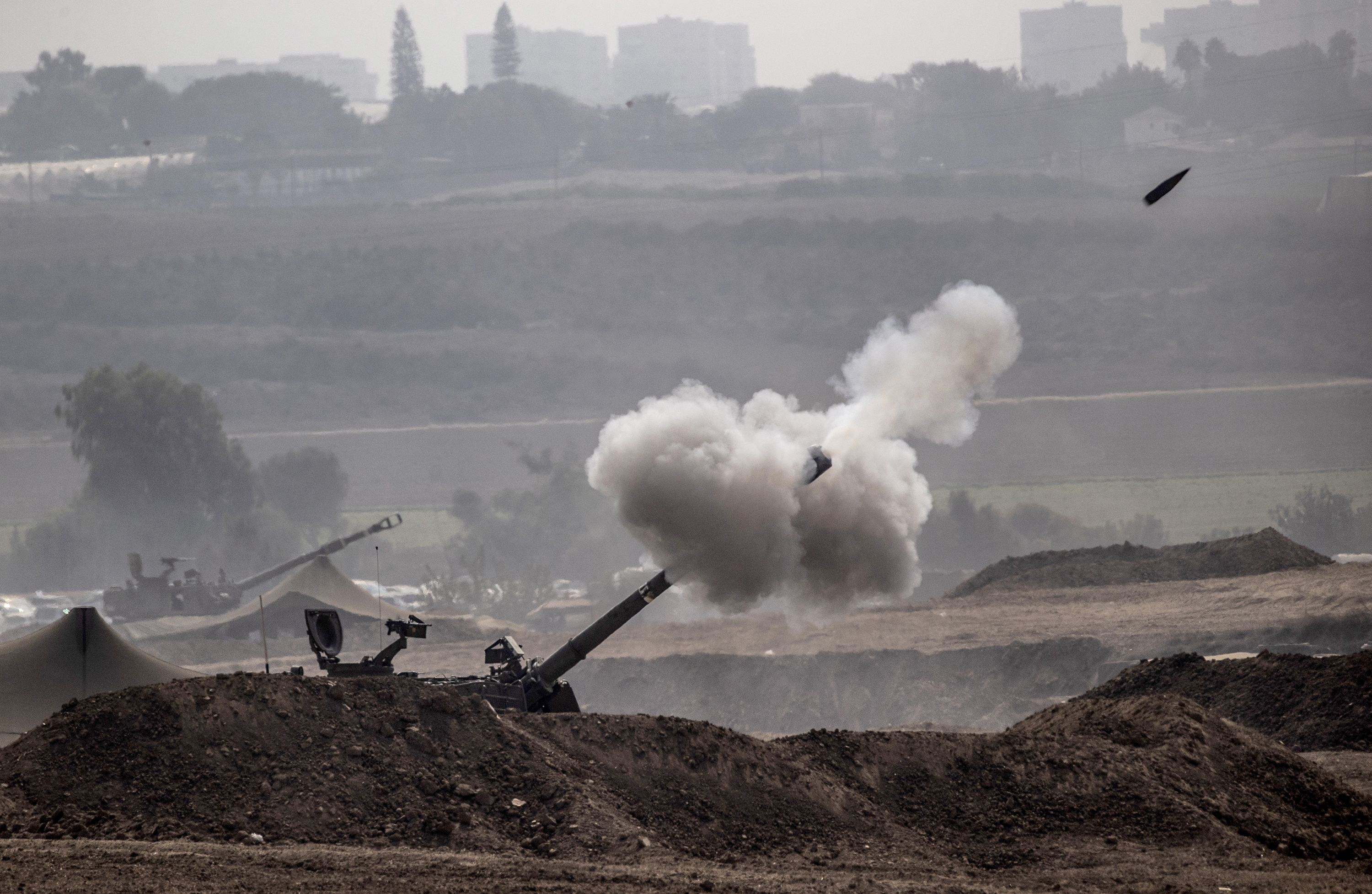 Smoke rises as Israeli forces on the border shell many parts of Gaza on October 28.