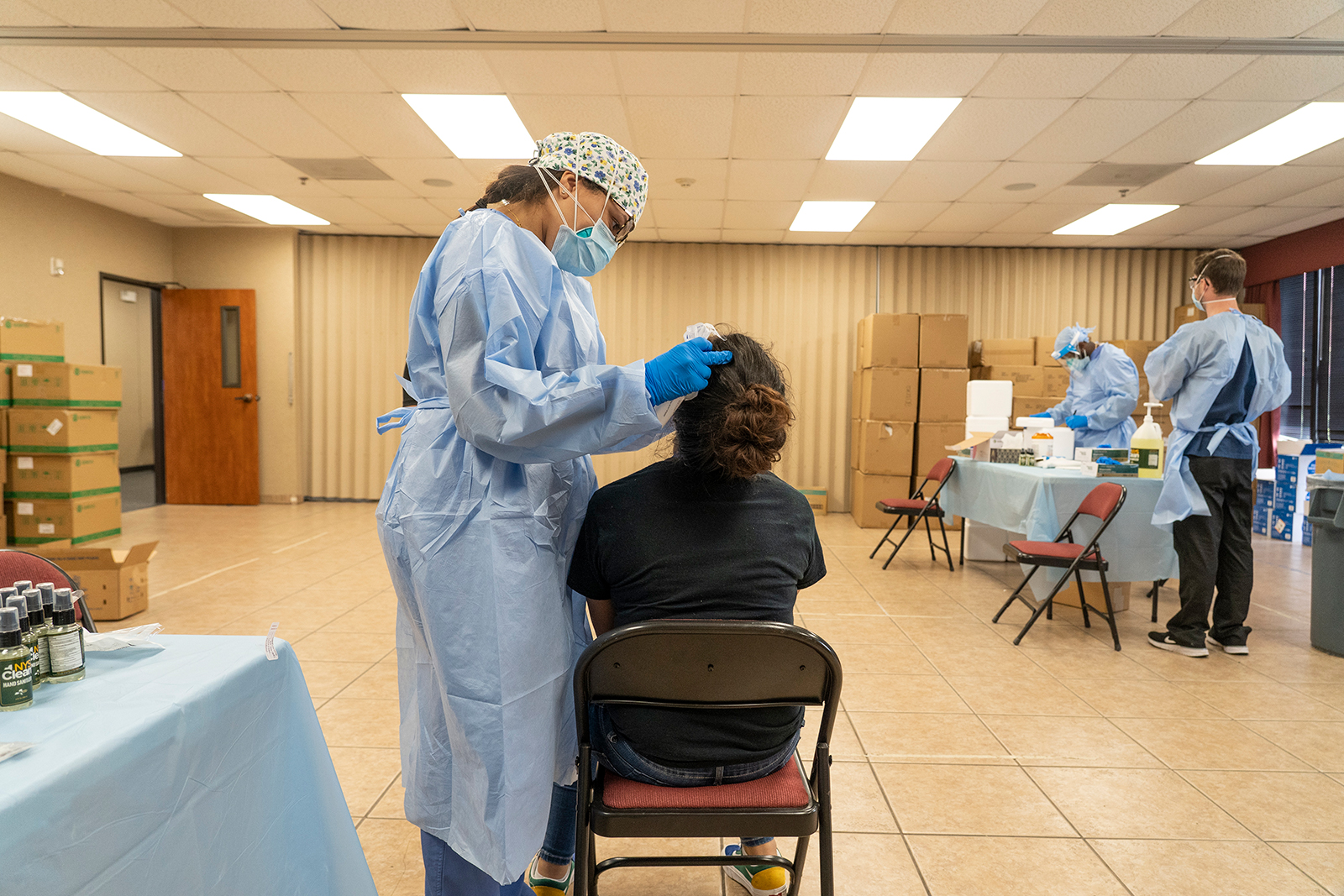 Medical workers from New York wearing personal protective equipment (PPE) test for the coronavirus at a temporary testing site in Houston on July 17.