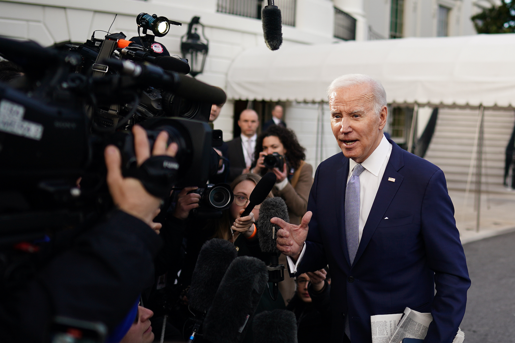 President Biden speaks to members of the media before boarding Marine One on the South Lawn of the White House on Friday.