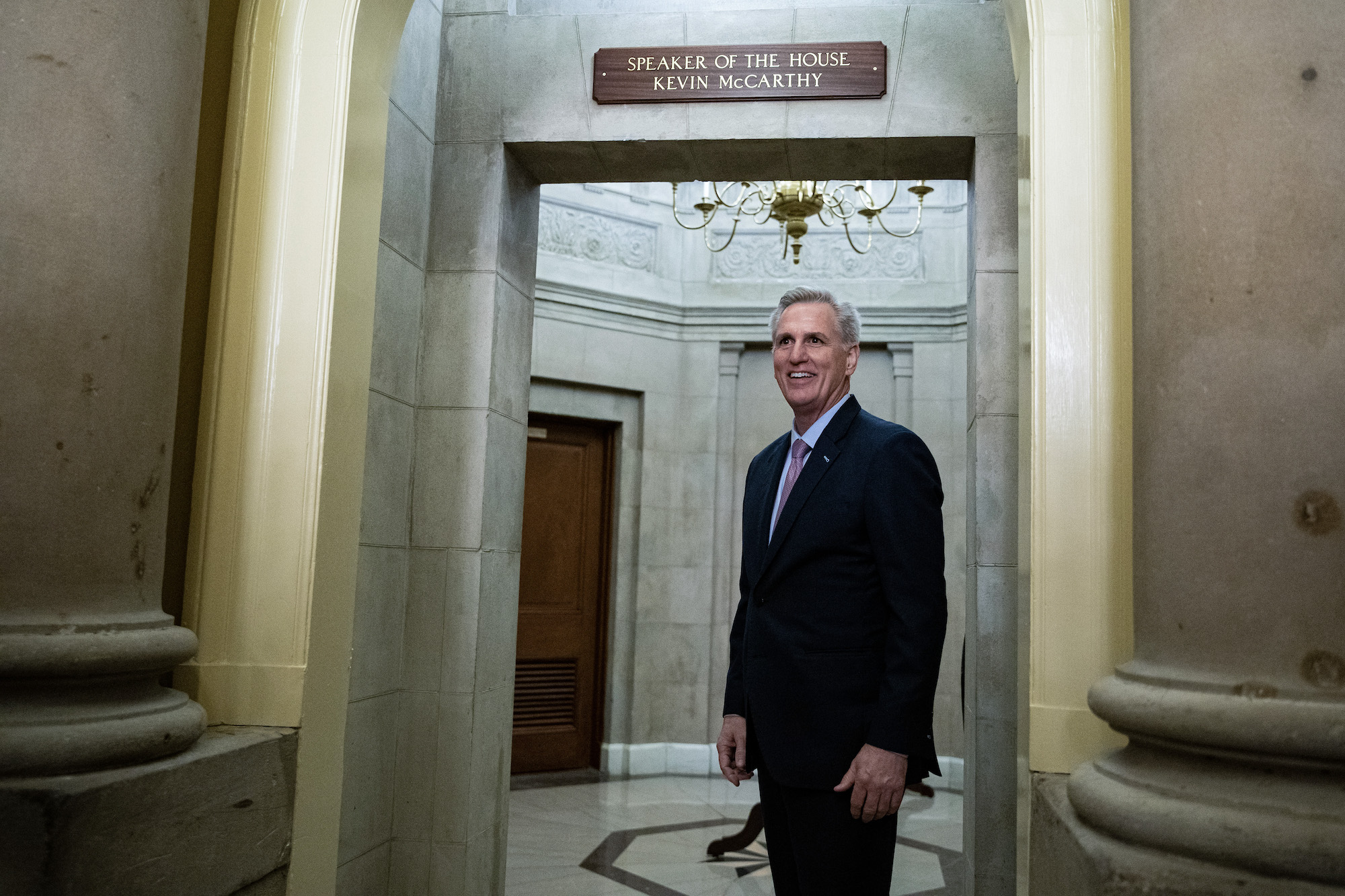 Kevin McCarthy stands under the Speaker of the House sign outside his office on Saturday morning.