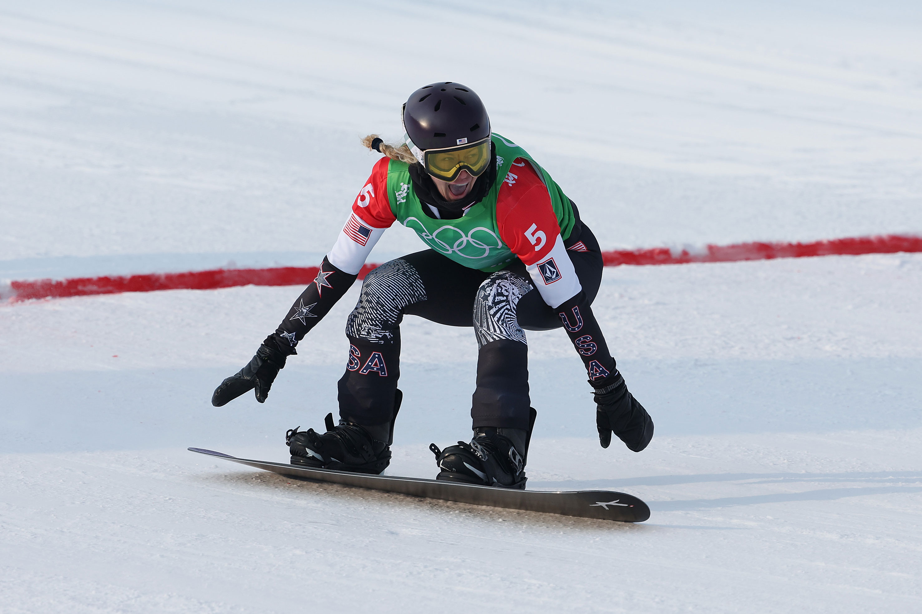 Lindsey Jacobellis reacts to crossing the finish line to win the gold medal during the women's snowboard cross big final on February 9.