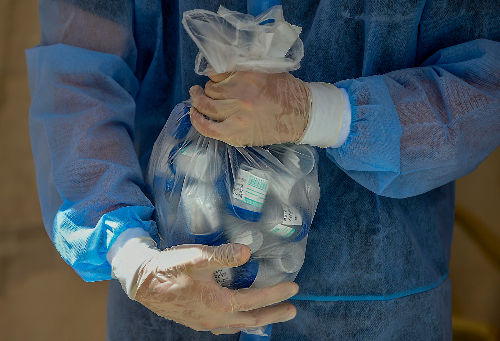 A healthcare worker carries Covid-19 tests in Bogota, Colombia on July 15.