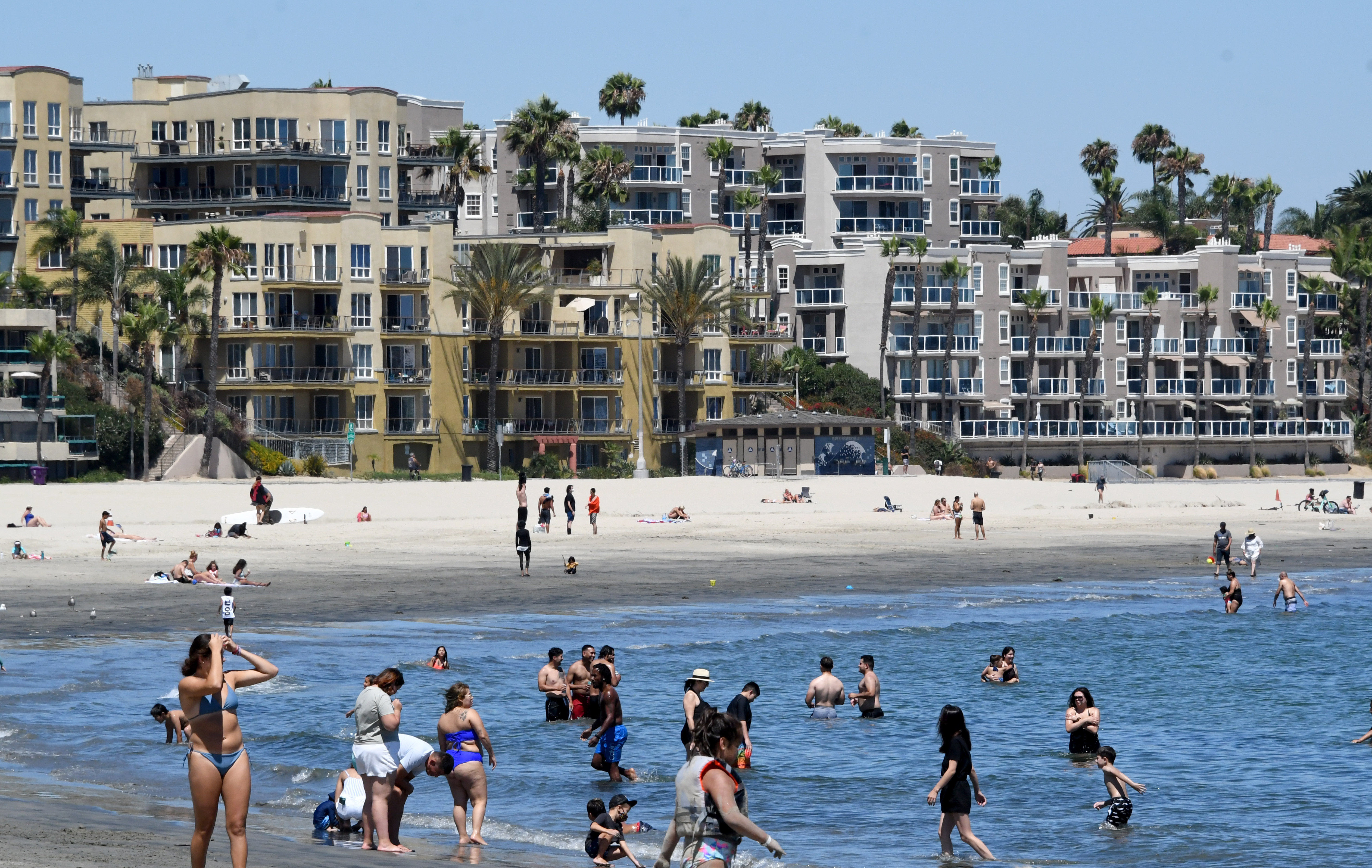 People visit Alamitos Beach in Long Beach, California, on July 18.