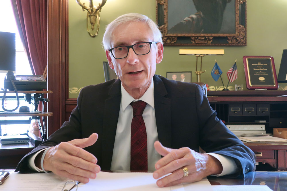 In this Dec. 4, 2019 file photo, Wisconsin Gov. Tony Evers speaks during an interview with The Associated Press in his Statehouse office in Madison, Wisconsin.