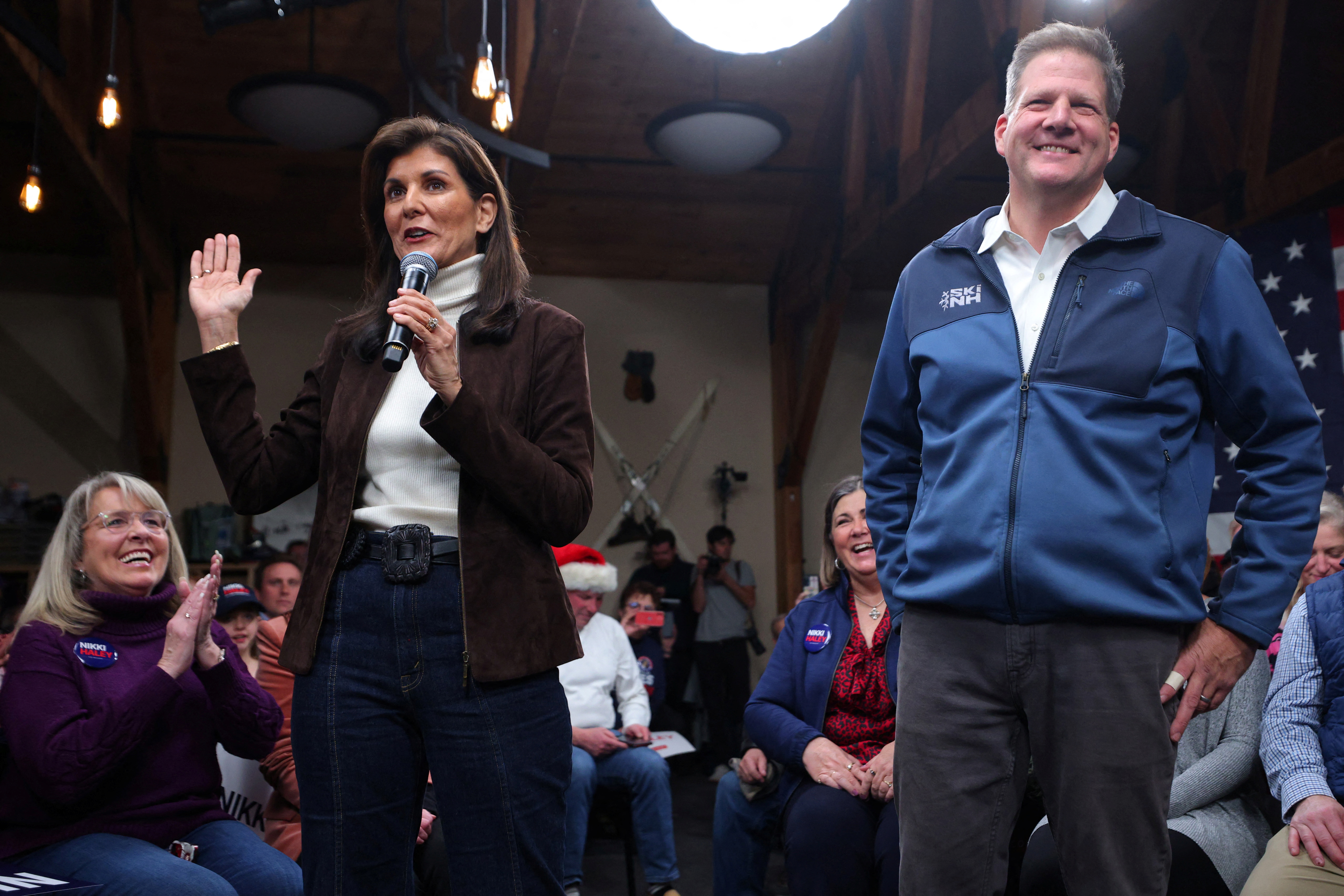 Former South Carolina Gov. Nikki Haley is endorsed by New Hampshire Gov. Chris Sununu at a campaign town hall in Manchester, New Hampshire, on December 12.