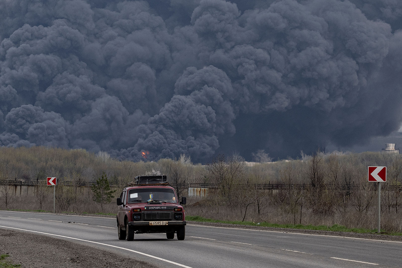 A car passes an oil refinery in Lysychansk after if was hit by a missile in the Luhansk region in Ukraine on Saturday. 
