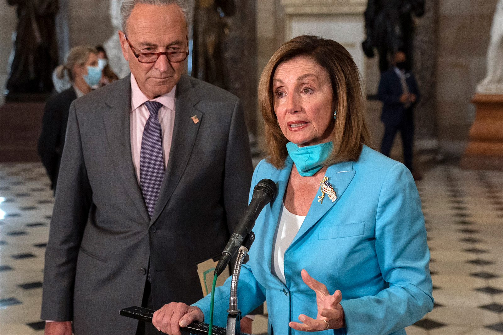 House Speaker Nancy Pelosi of Calif., joined by Senate Minority Leader Sen. Chuck Schumer of N.Y., speaks to media on Capitol Hill in Washington, on Wednesday, August 5.