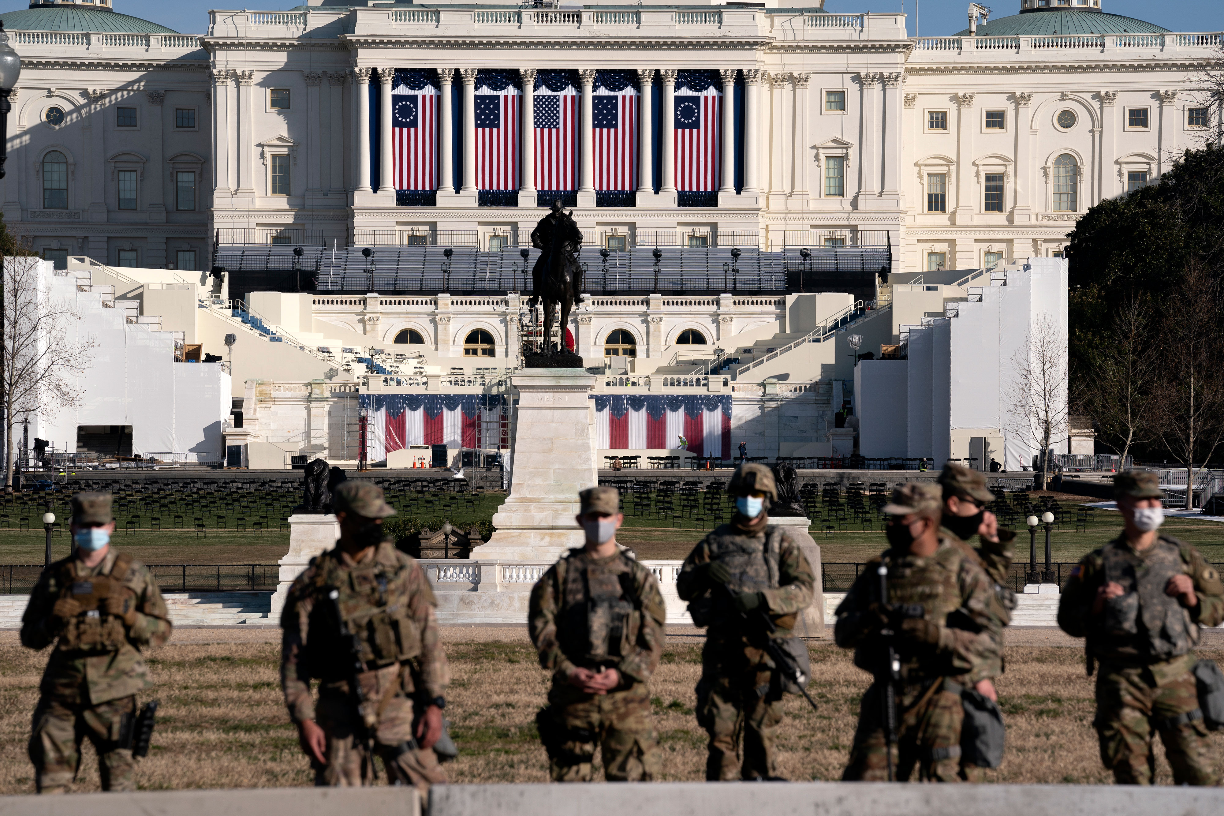 Members of the National Guard stand near the Capitol on January 14.