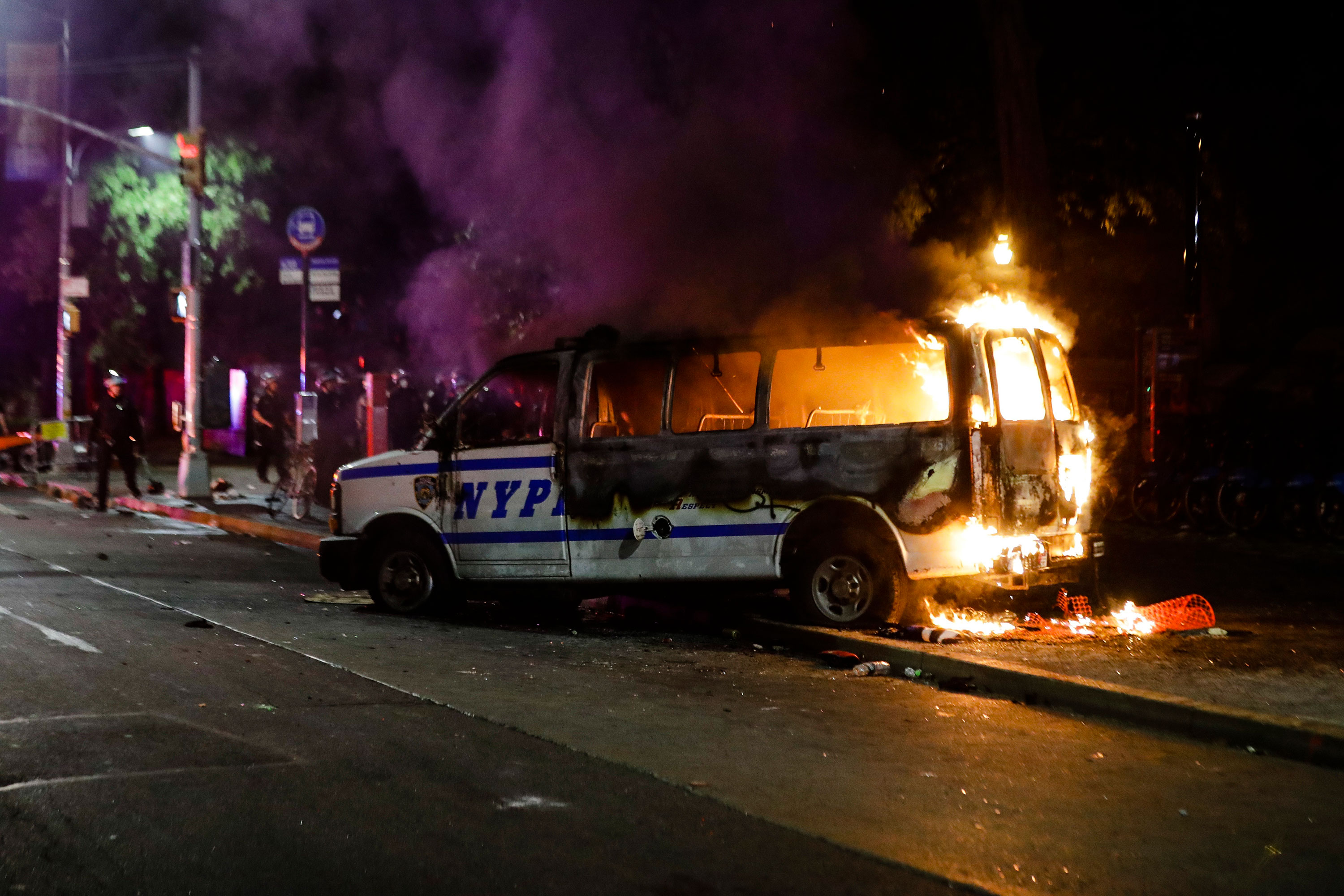 A police vehicle burns in Brooklyn on May 29.