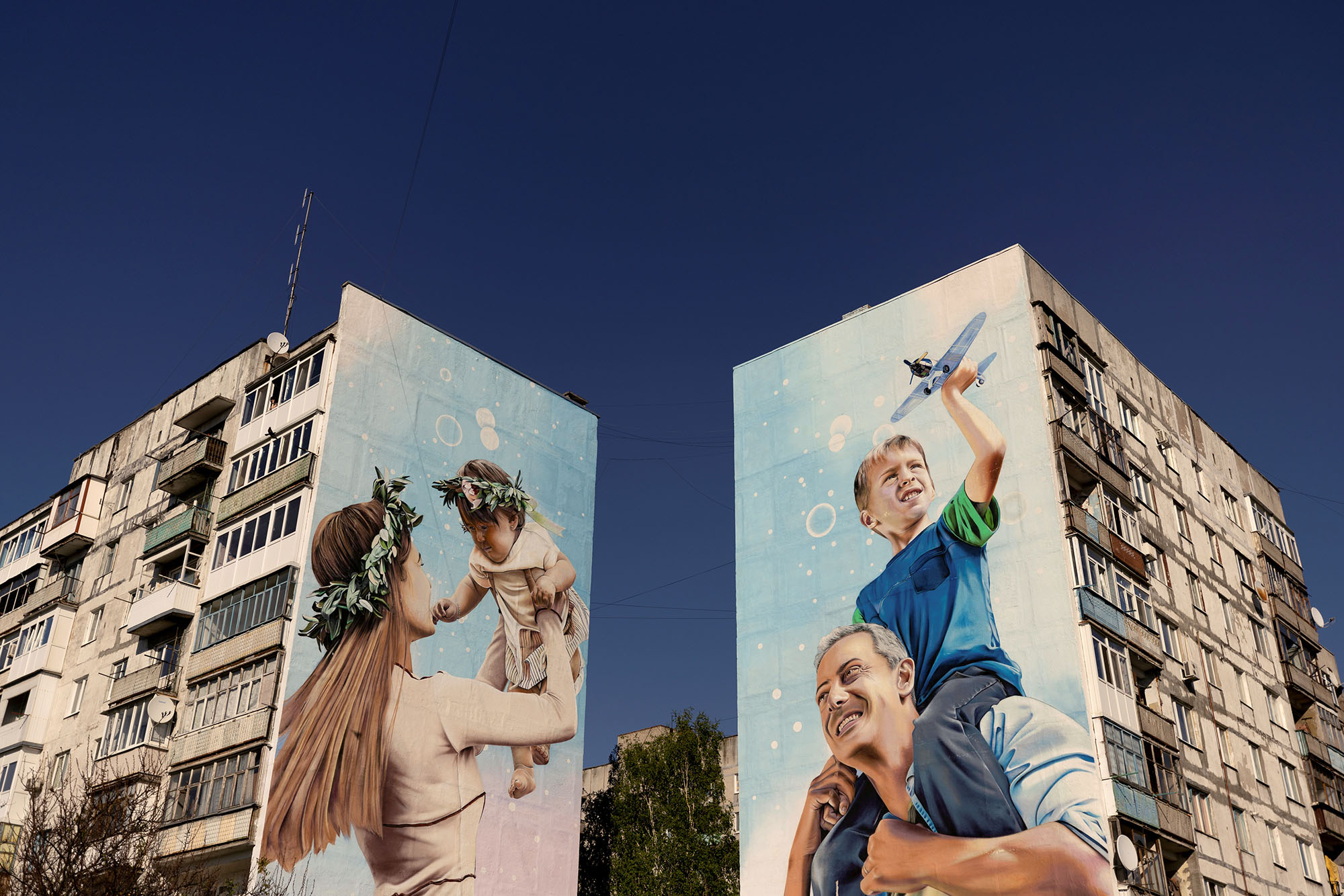 Murals are painted on the side of apartments blocks, in Bakhmut, Ukraine, on May 6, 2022.