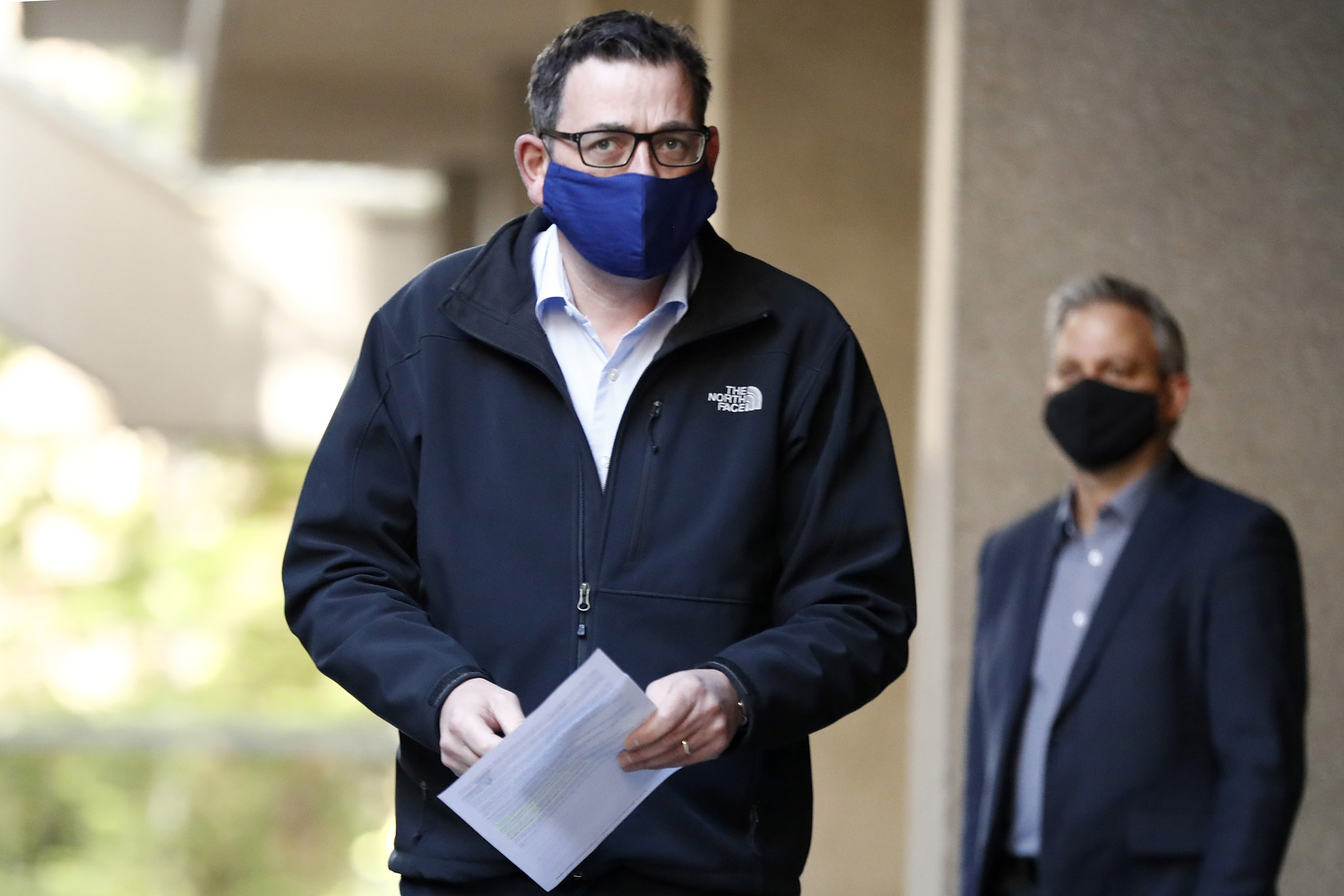 Victorian Premier Daniel Andrews wears a face mask as he walks in to the daily briefing on July 19, in Melbourne, Australia. 
