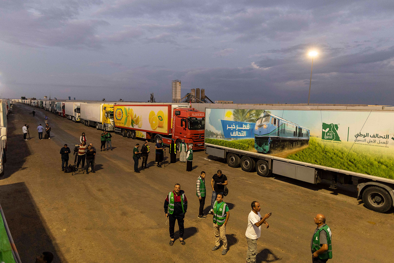 Aid convoy trucks are seen at Rafah border on Tuesday, October 17,  in North Sinai, Egypt.