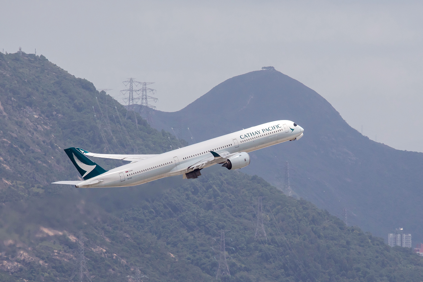 An aircraft operated by Cathay Pacific Airways takes off at Hong Kong International Airport on August 7.