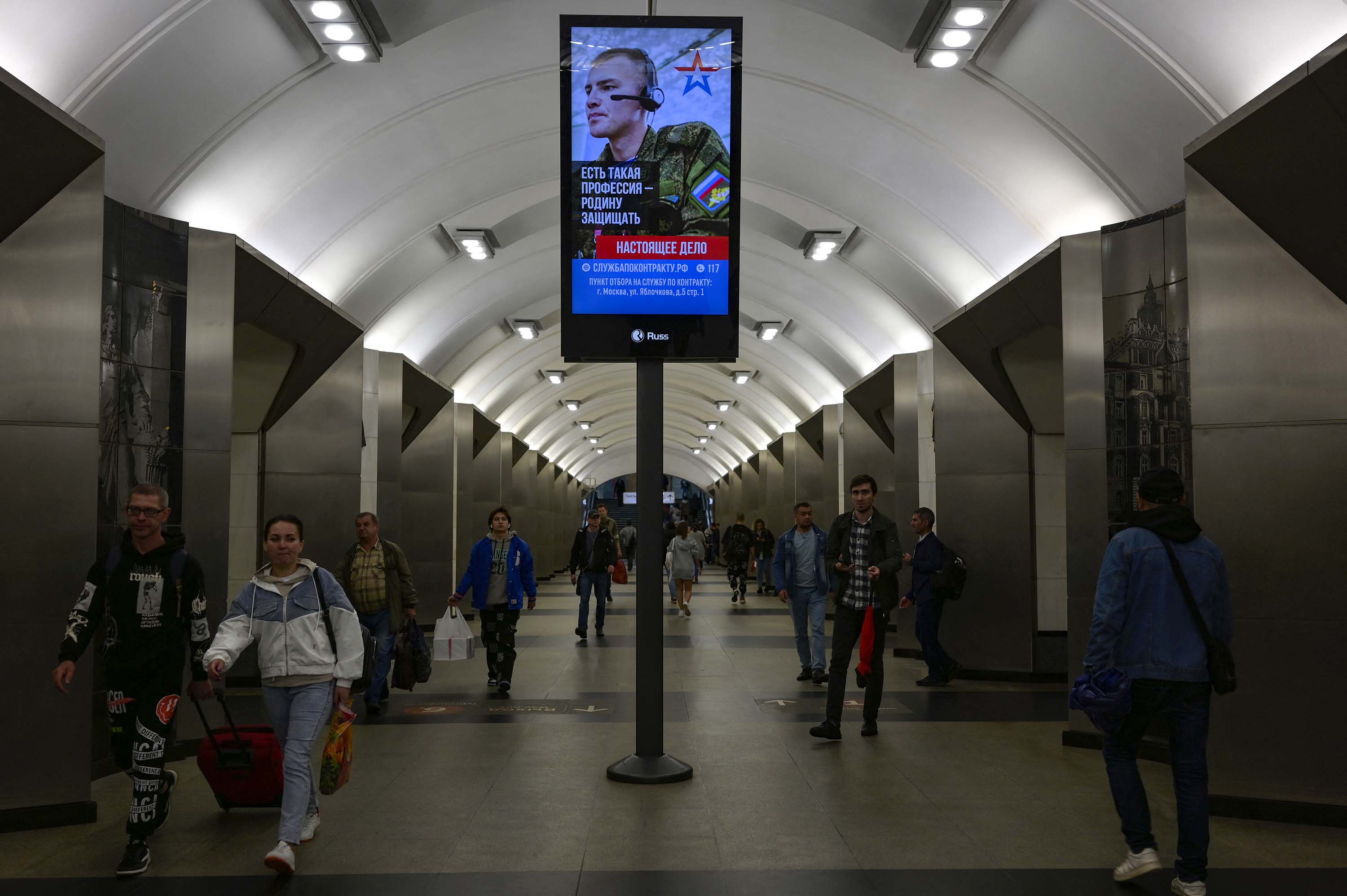 An advertisement promoting contract military service in the Russian army is seen in a Moscow metro station on July 19.