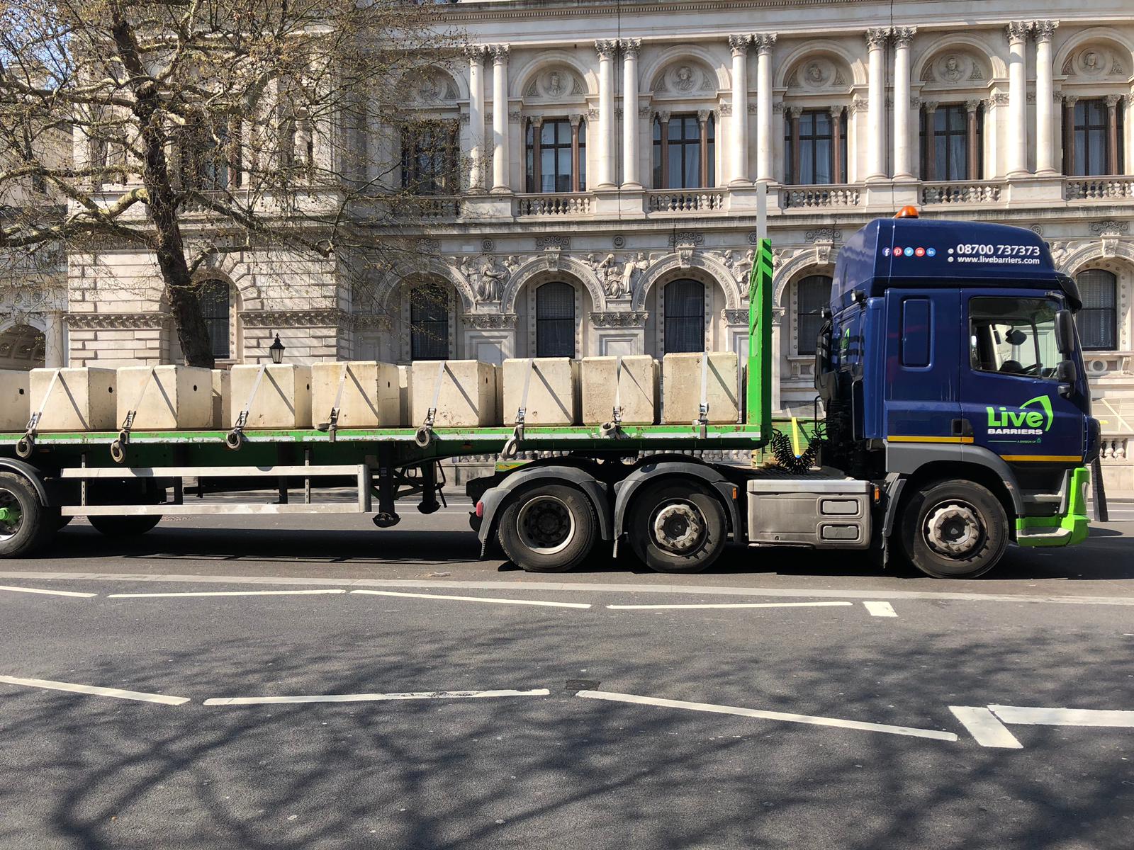 Trucks carrying concrete blocks arrive in central London on Friday. 