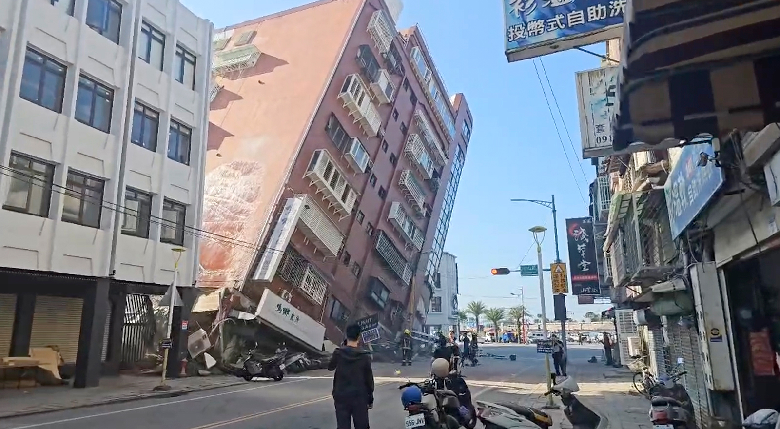 In this image taken from a video run by TVBS, a partially collapsed building is seen in Hualien, eastern Taiwan on Wednesday, April 3.