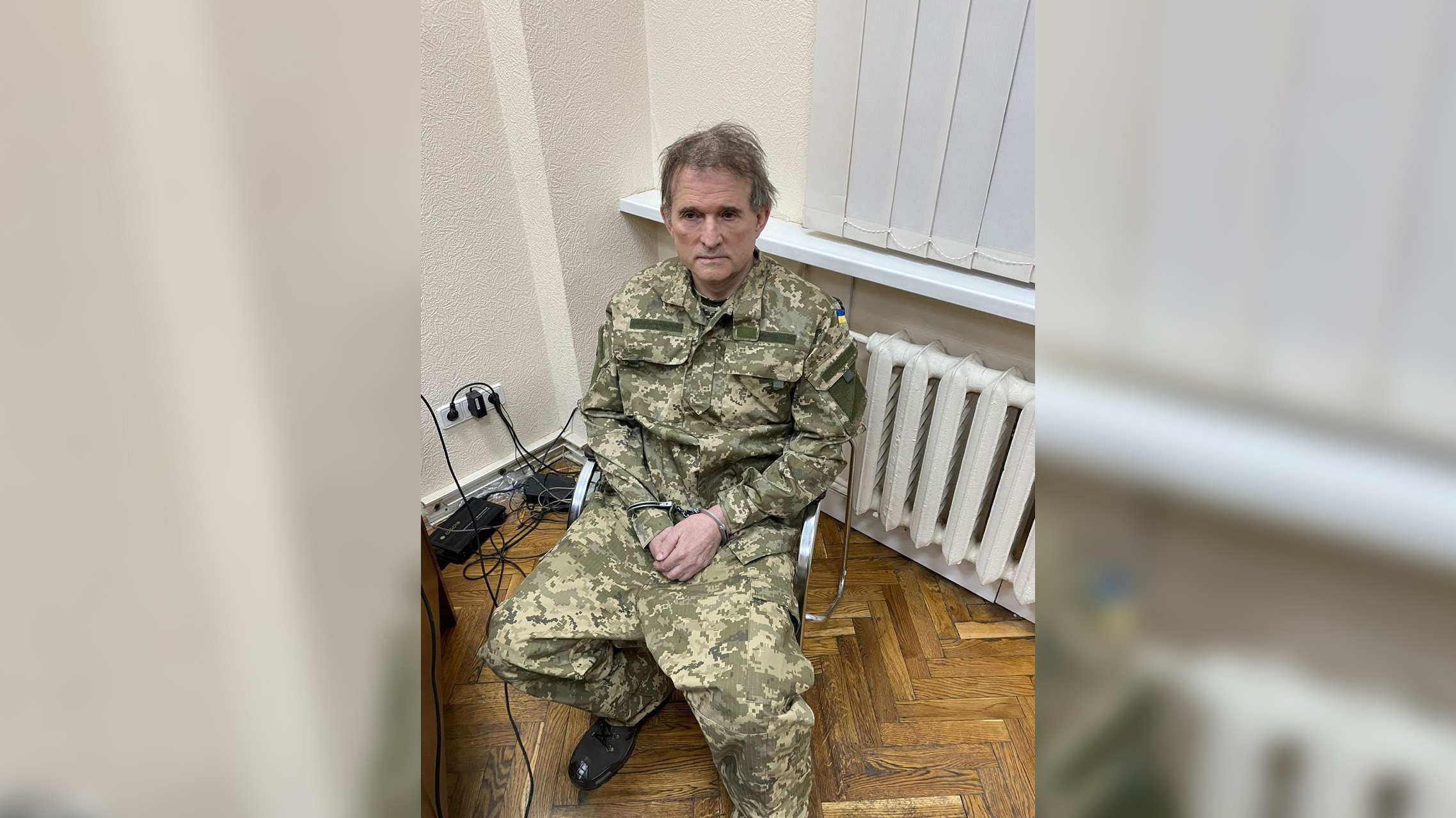 Viktor Medvedchuk, a pro-Russian Ukrainian politician and oligarch sits in a chair with his hands cuffed after a "special operation" was carried out in Ukraine on April 12.