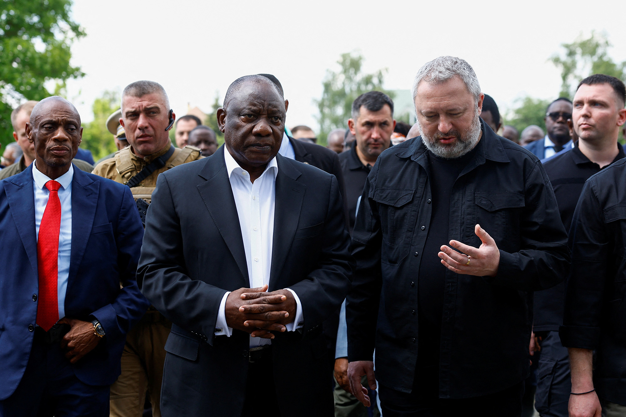South African President Cyril Ramaphosa, center left, and Ukraine's Prosecutor General Andriy Kostin visit a site of a mass grave, in the town of Bucha, Ukraine, on June 16.