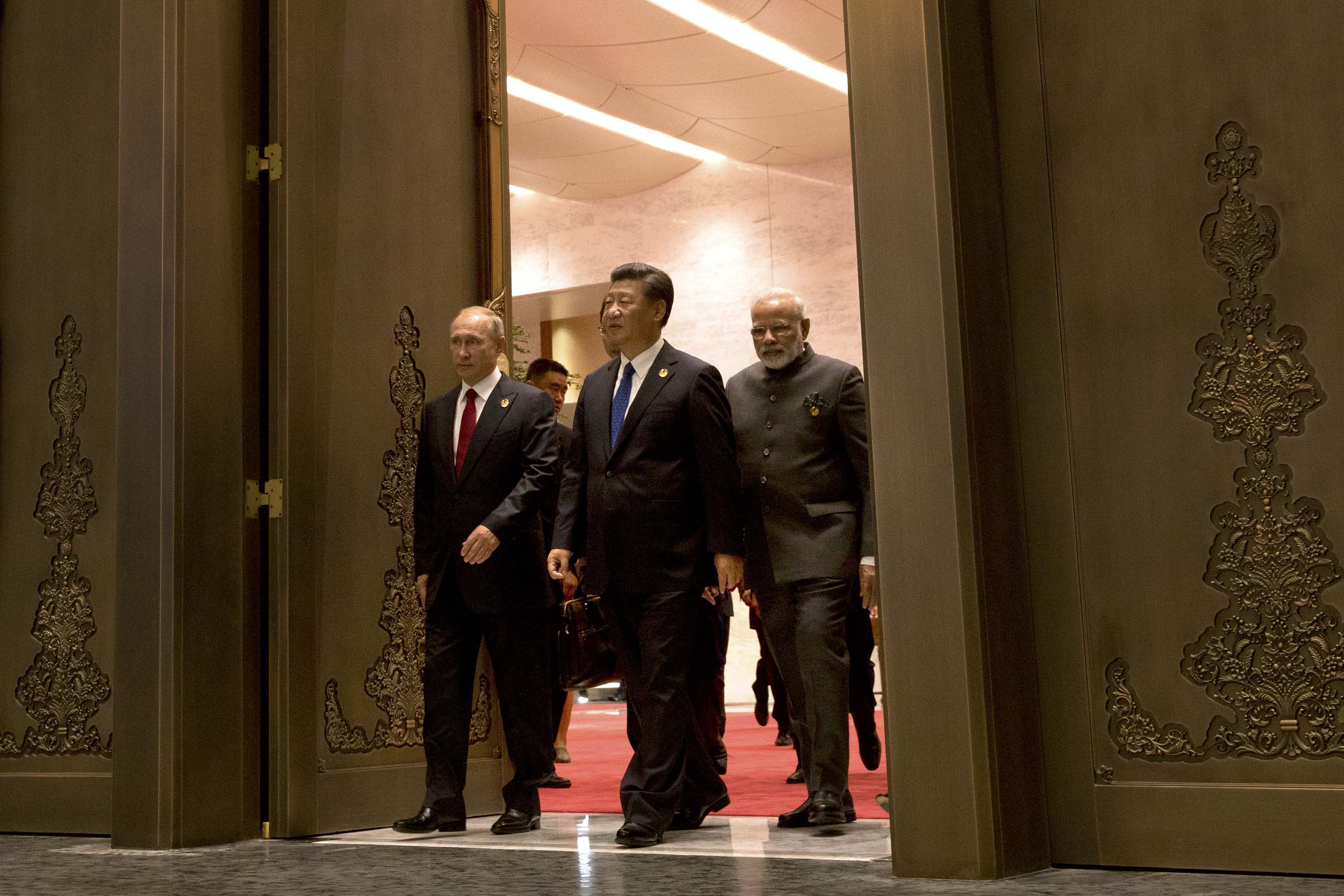 Russian President Vladimir Putin, Chinese President Xi Jinping and Indian Prime Minister Narendra Modi arrive for the 2017 BRICS Summit in Xiamen, China on September 5, 2017.