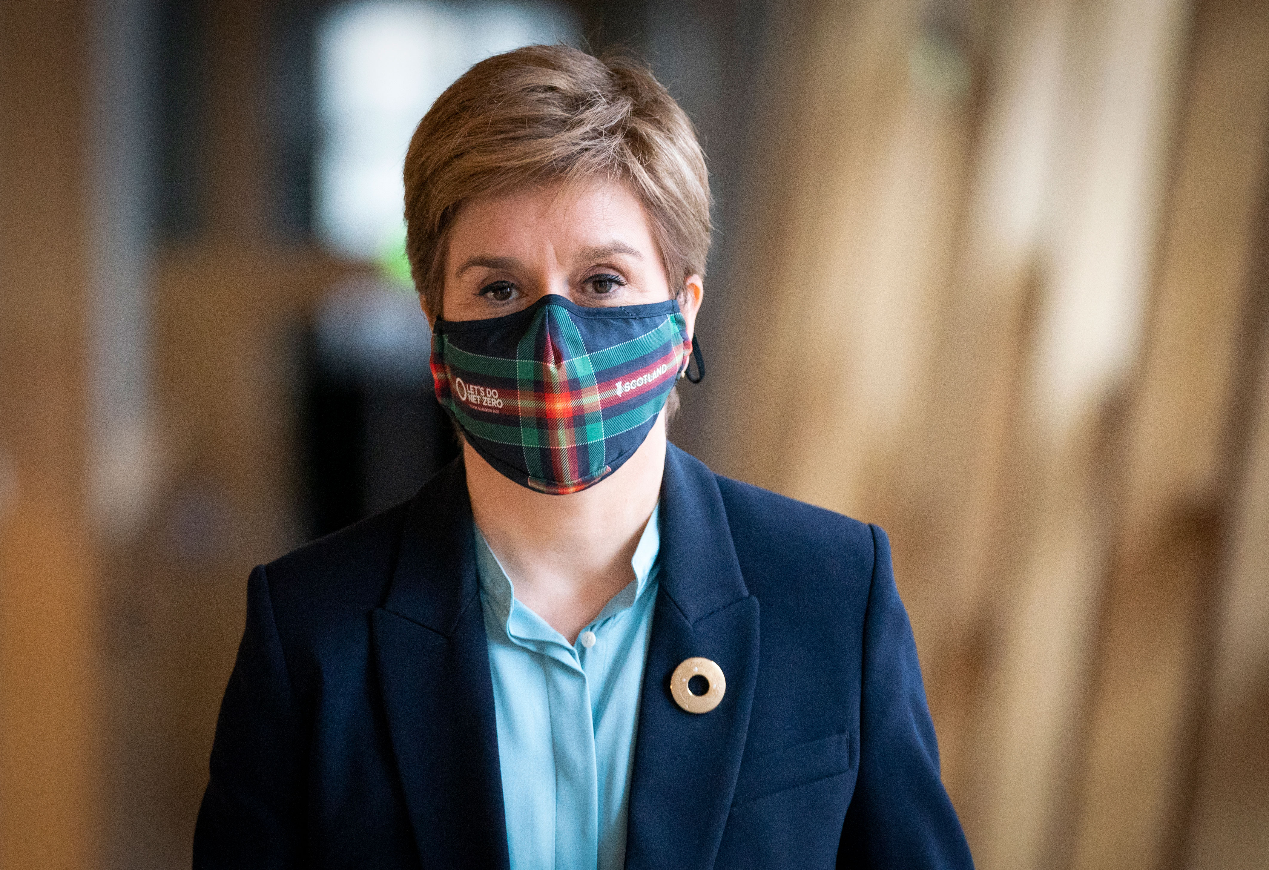 First Minister of Scotland Nicola Sturgeon arrives at the main chamber in the Scottish Parliament on November 30 in Edinburgh.