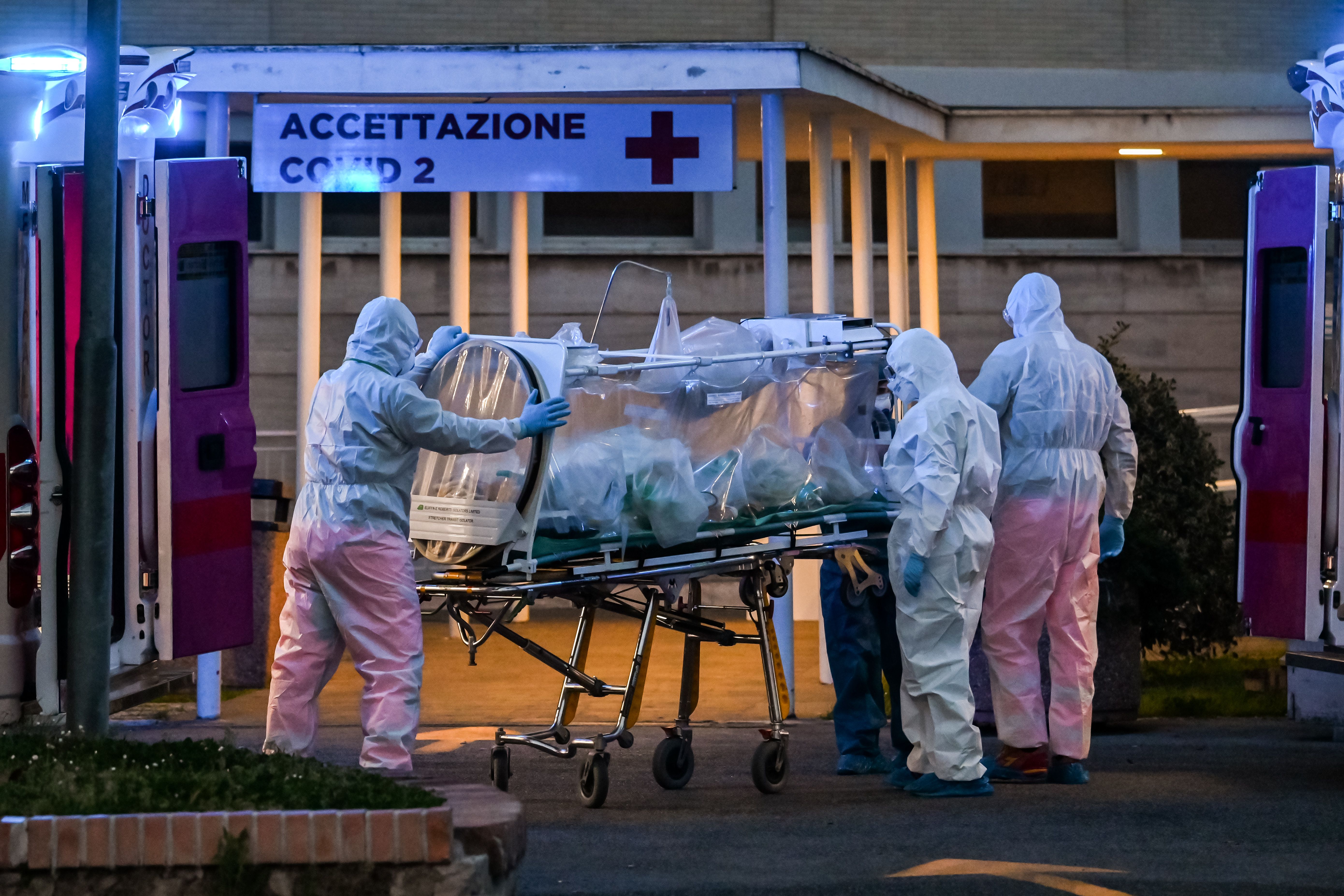 Medical workers move a coronavirus patient into a temporary facility at the Gemelli hospital in Rome, Italy on March 16.