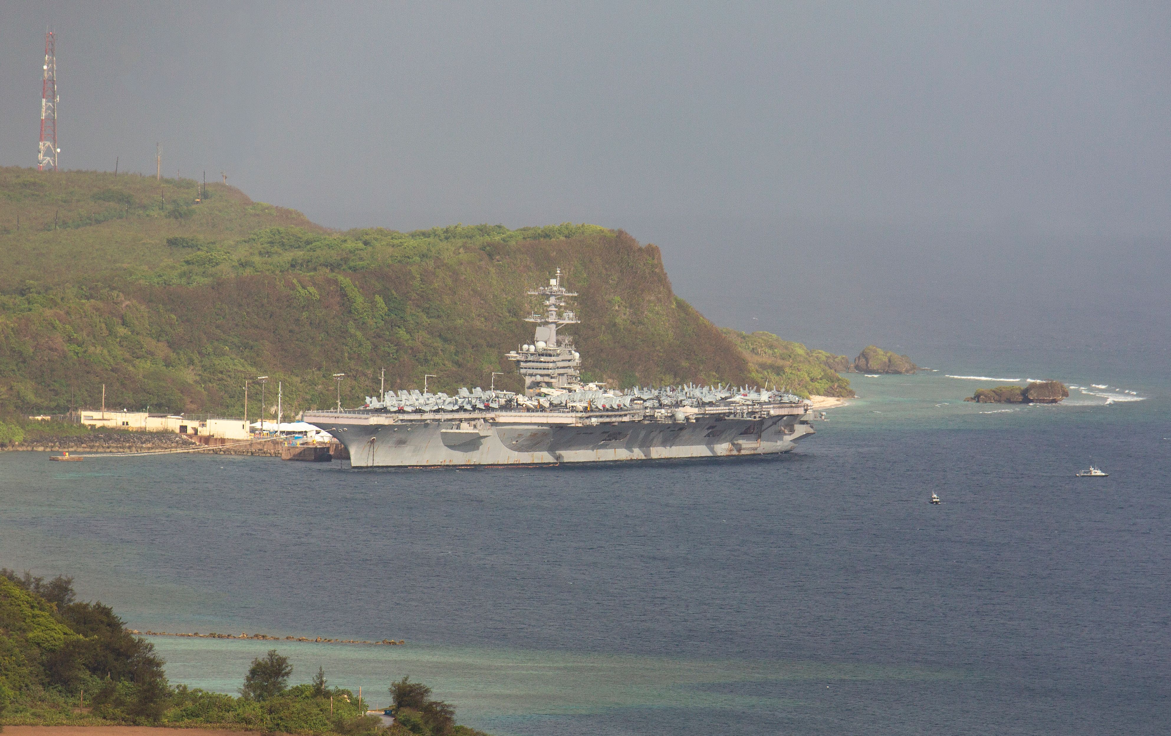 The USS Theodore Roosevelt docked at Naval Base Guam in Apra Harbor on April 27.