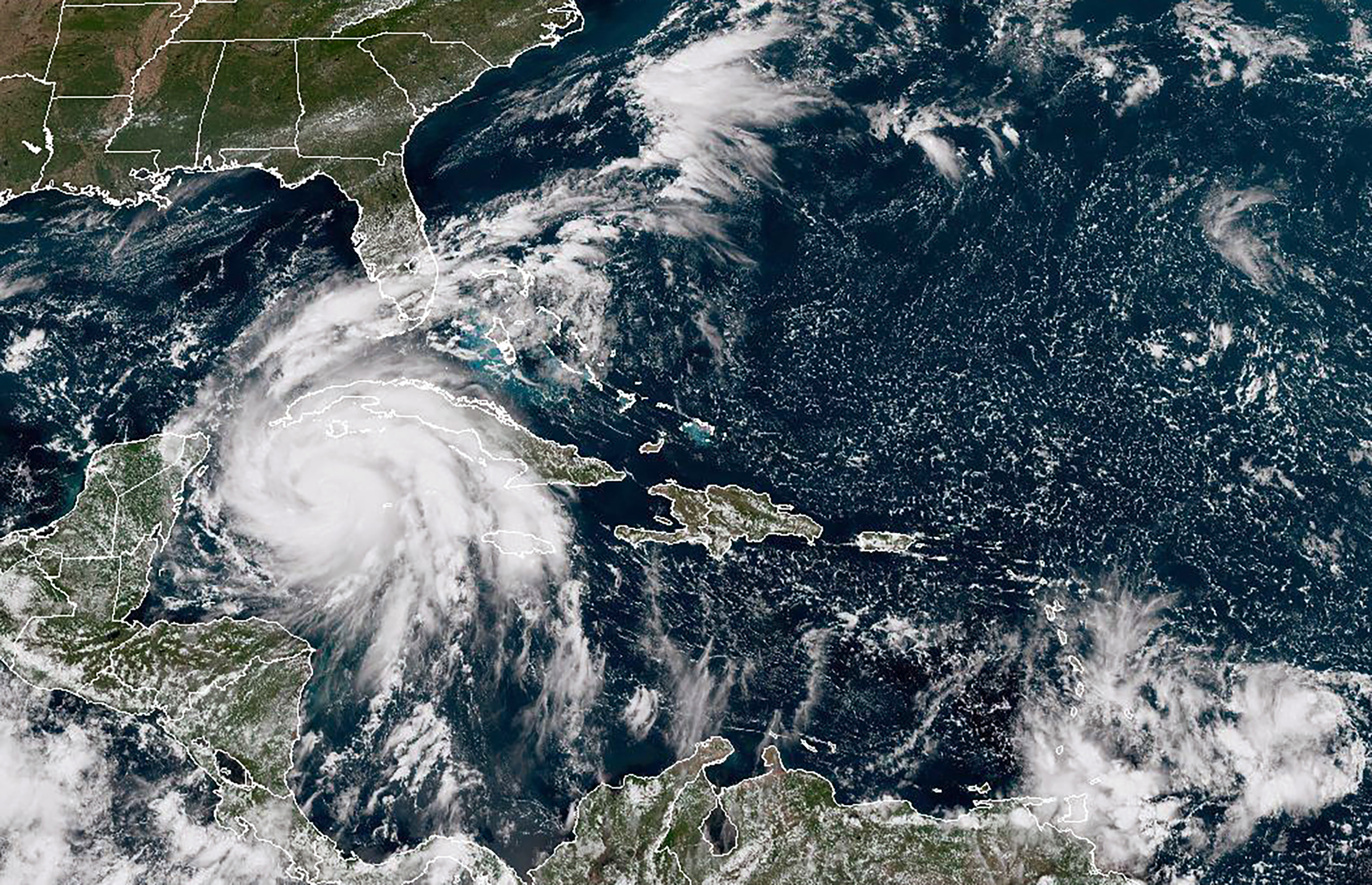 A satellite image from the National Oceanic and Atmospheric Administration shows Hurricane Ian moving toward western Cuba, on Monday at 1:30 p.m. ET. 