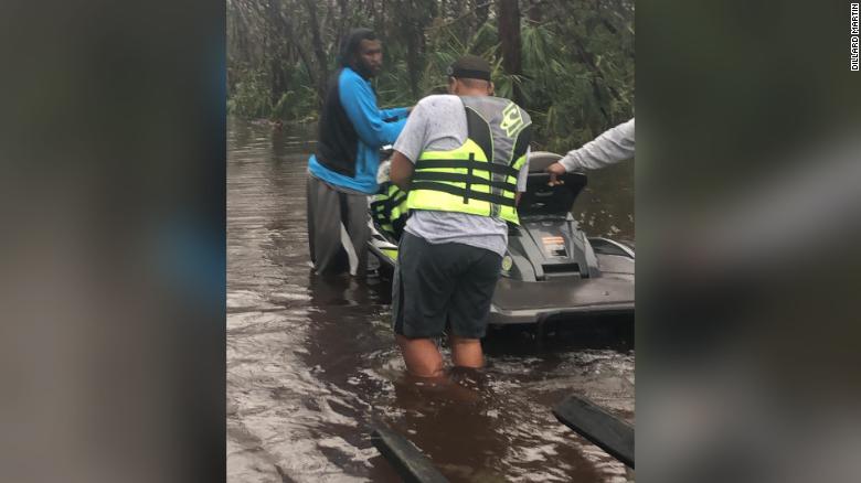 A dozen jet skiers worked together to rescue 100 people on Tuesday.