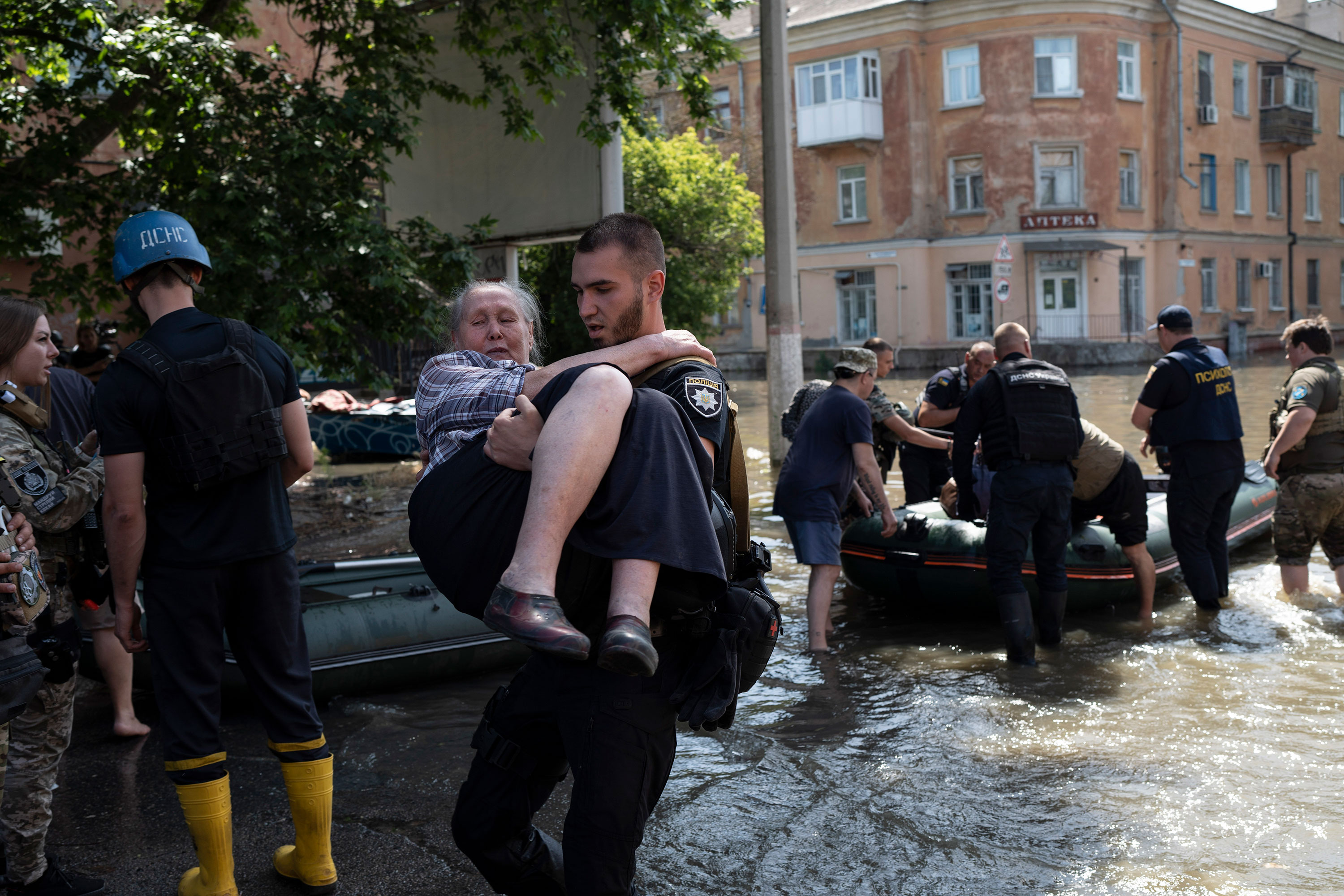 Residents are evacuated from a flooded neighborhood in Kherson on June 7. 