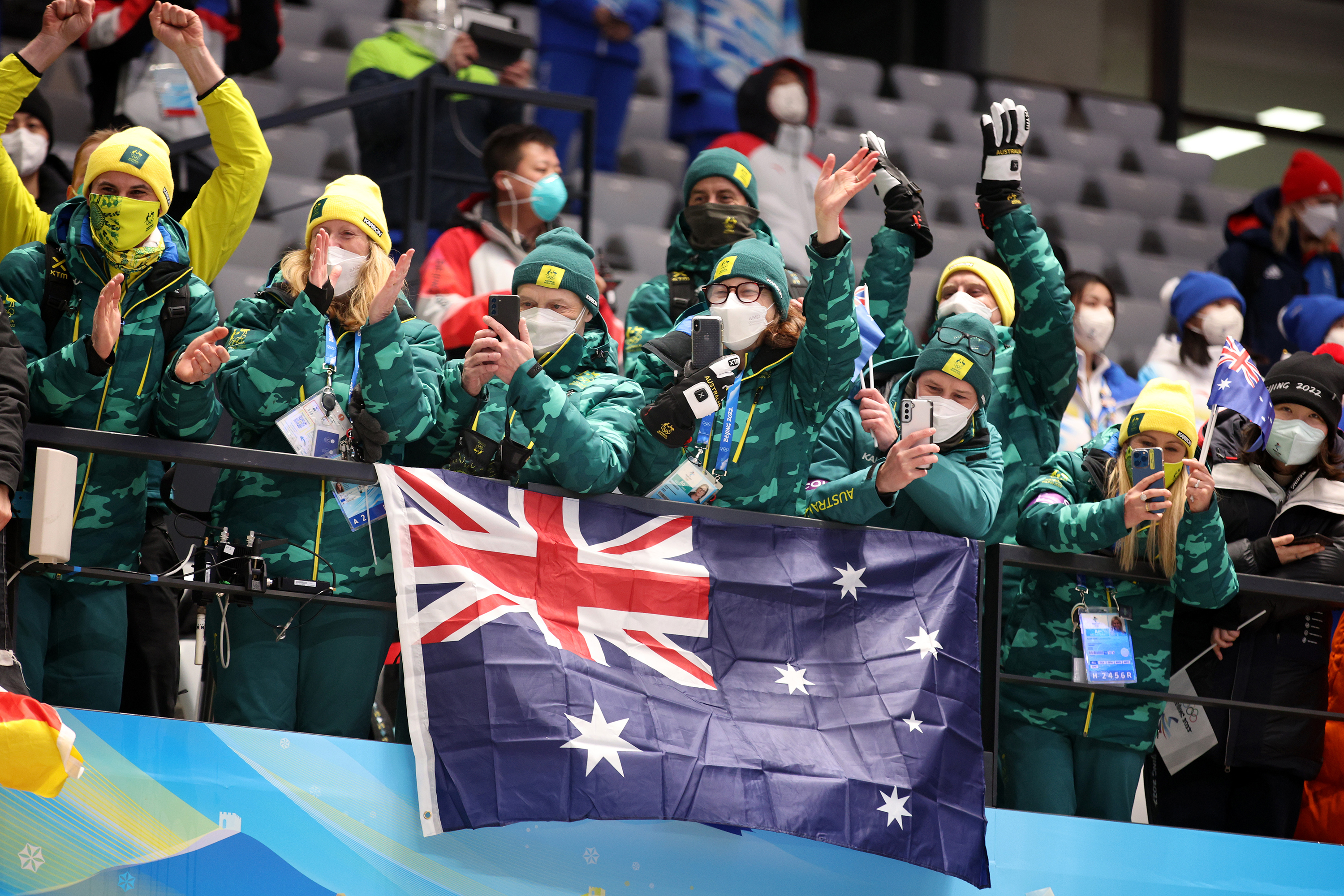 Fans cheer as Australia's Jaclyn Narracott receives her medal during the women's skeleton medal ceremony on Feb. 12.